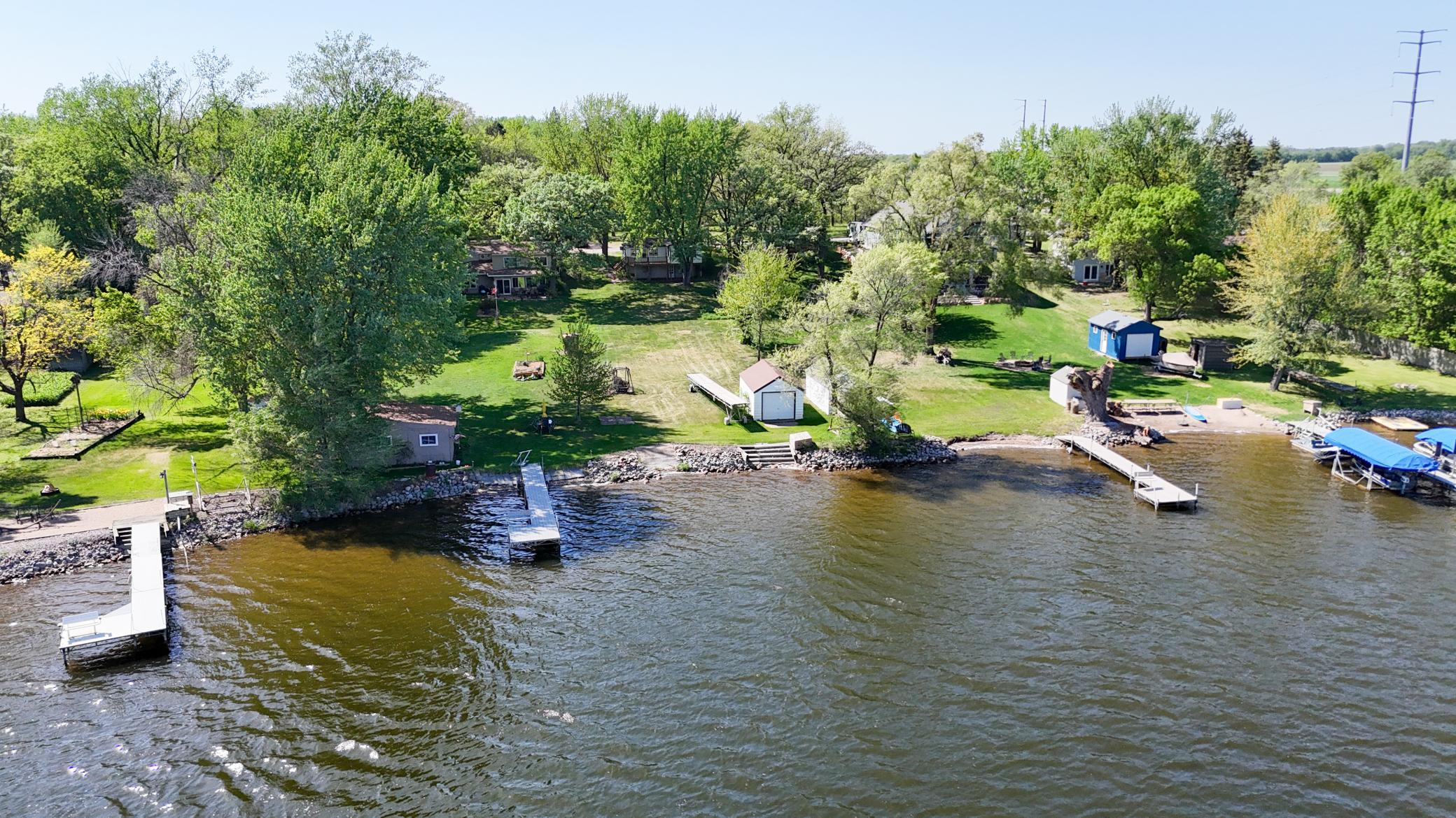Looking for a lake lot to build your dream home on?  Here it is!  This cabin is a tear down on a nice gradually sloped lot.  It is a perfect lot to build a walk out style home, no stairs to the lake are needed.  This property comes with 2 LOTS, the cabin lot .427 (60x304) and a bonus lot across the street .26 (75 x 155).  The Bonus lot is big enough to build a garage on and install a new septic system if you choose to put it there, it has plenty of room for both.  Located near I-94 for quick communte.  The current septic system is non-compliant and will need to be replaced.  Don't miss out on this PRIME property on a great fishing lake!