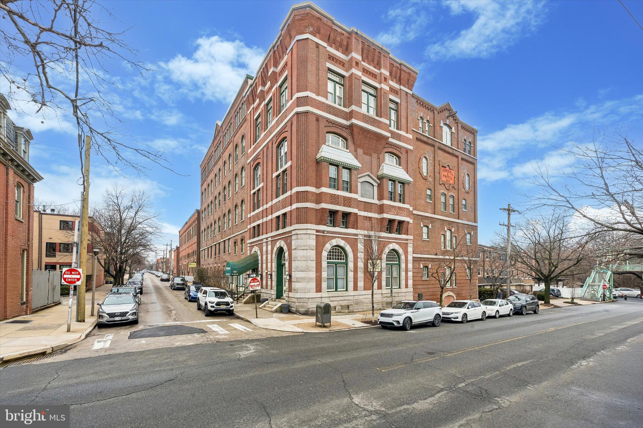 Have you been searching for a spacious, turnkey flat with off street parking in a prime Philadelphia location? 825 N 29th St, unit 4G is ready for its next owner!  Situated in the historic Brewery Condo building, this south facing 4th floor unit has stunning city views, soaring ceilings, and a surprisingly spacious layout. When you enter this home, you'll see two large closets with custom shelving - a space saving bonus! The main living area is beautifully designed with two large, arched windows as the home's main focal point. The generous studio easily accommodates both living and dining areas.  A convenient kitchen boasts stainless steel appliances, a dishwasher and another storage closet. The bedroom area has yet another large closet and provides seamless access to a full bath with tub and shower.  The stacked washer dryer are situated in the bathroom as well, with a space saving barn door to stylishly tuck it away. The overall efficiency of this unit, with it's fabulous layout and multiple closets, allows your personal decor to shine and lets the city skyline to do the rest of the wowing.If the view from your unit isn't enough, head up to the shared roof deck for sweeping panoramic views of the city, perfect for watching the fireworks on New Years Eve or enjoying a summer cocktail while you work on your tan! Craving more time outdoors? A foot bridge just half a block from the condo takes you to Lemon Hill Park and provides access to the Schuylkill River Trail. And of course, this location is unbeatable, with a serene feeling of being tucked away while in walking distance of all the shops, restaurants and culture the Art Museum Area has to offer.The Brewery Building is professionally managed and well sheltered, from the secured front door and vestibule to the key-only elevator access. The gated off street parking requires a fob. The monthly condo fee includes common area maintenance, the roof and building envelope, parking, snow & trash removal and - one less utility bill for you - water! This home is an oasis - a perfect pied a terre, artist's studio, or apartment - a blank canvas waiting for it's next owner's vision.  Schedule your showing today!