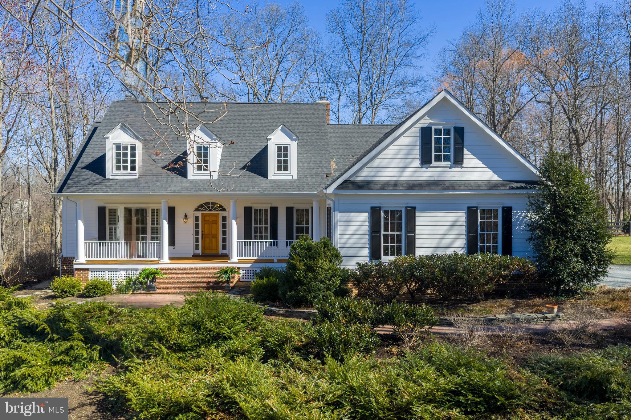 Welcome home to this beautifully crafted custom colonial set on 3.3 scenic acres with peaceful water views in the desirable Ashley Springs community. It is truly one of a kind! Built in 2000 and meticulously maintained, this property offers the perfect blend of timeless architecture, modern comfort, and serene countryside living just minutes from the heart of Purcellville. A charming custom front porch with Brazilian hardwood Ipe welcomes you to the home and sets the tone for the quality and craftsmanship found throughout. Inside, the home offers over 4,000+ square feet of finished living space, along with a 2,400 square foot unfinished basement ready to be customized to suit your needs.The gourmet kitchen is designed for both everyday living and entertaining, featuring granite countertops, a large center island with a gourmet sink, and high-end appliances including a Thermador refrigerator (2024), Viking stove, Bosch dishwasher (2022), and GE microwave (2024). The kitchen flows beautifully into the surrounding living spaces, where two wood-burning fireplaces and gorgeous moldings create warmth and character throughout the home.The main-level primary suite offers a peaceful retreat with a spacious bedroom, a spa-like ensuite bathroom featuring a soaking tub and enclosed glass shower, and a large walk-in closet. The main level also includes a gorgeous living room with custom built-ins, two private offices ideal for working from home, as well as a mudroom, laundry room and a powder room for everyday convenience.Upstairs, you’ll find three additional bedrooms. Two bedrooms share a Jack-and-Jill bathroom, while the third bedroom features its own private ensuite bath, providing comfort and flexibility for family or guests. An unfinished space above the garage offers exciting possibilities and could easily be transformed into a game room, studio, or additional living area.The basement provides an additional 2,400 square feet of unfinished space, offering endless opportunities for customization—whether you envision a recreation room, home gym, theater, or guest suite.Outside, the 3.3-acre property offers privacy, open space, and beautiful views of nearby water, creating a peaceful setting to enjoy nature, entertain, or simply relax.Many updates have been made to this home including roof (2019), refinished hardwood floors (2024), HVAC (2025), Heat Pump (2022), Aprilaire humidifier (2024), driveway regraded (2025), septic pump and all floats replaced (2023), well pump and sand filter replaced (2021), and lots more. With its thoughtful layout, extensive living space, and stunning natural surroundings, 20322 Sommerset Ct offers a rare opportunity to enjoy custom living in one of Purcellville’s most scenic communities while still being close to local shops, restaurants, wineries, and commuter routes. Make this your home, schedule your showing today!
