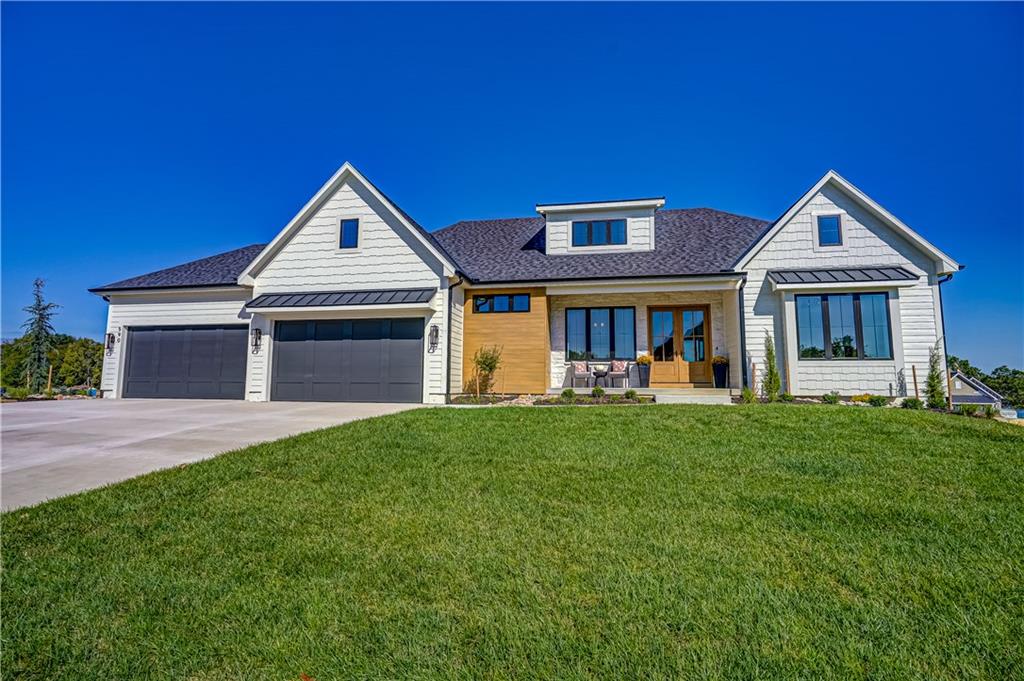 Welcome to The Westbrook II by Bellah Homes in Lake Winnebago! This brand-new, 4-bedroom home offers 4 full baths, 2 half baths, a 4-car garage and beautiful lake views. Its open, highly functional layout brings together inviting everyday spaces and plenty of room to entertain.Wood ceiling beams and accent lighting draw your eye to the living room's stone fireplace. In the kitchen, upgraded quartz and granite countertops and backsplash complement a Venetian plaster-finished hood cabinet. High-end appliances include a panel-ready built-in Monogram refrigerator/freezer, GE Café range, double ovens and a drawer microwave. A huge walk-in pantry is conveniently located near the prep kitchen. Large sliders from both the living and dining rooms lead to the oversized deck, where a floor-to-ceiling stone fireplace creates another gathering spot. Relax outdoors overlooking green space and the beautiful 400-acre recreational lake.The main-level primary suite is a private retreat with a spacious bedroom and bath featuring an oversized zero-entry shower with dual heads, freestanding soaking tub and dual sinks. Its large walk-in closet has pull-downs and connects directly to the laundry room. A second main-level room offers flexibility as a bedroom or office and includes its own private bath.The walkout lower level has room to host game nights or watch the big game. Its detailed wet bar features custom cabinetry and upgraded countertops. Two more bedrooms each have a dedicated bath, while a second laundry hookup and abundant storage add convenience. Step out to the custom stamped patio and flat backyard. Additional upgrades include distinctive tile and lighting packages and a 96% efficient, dual-stage variable-speed zoned HVAC system.Enjoy all that Lake Winnebago has to offer: walking trails, a new resort-style pool, Arrowhead Yacht Club and a community park. The lake invites you to fish, kayak, enjoy water sports or simply cruise and take in the views.