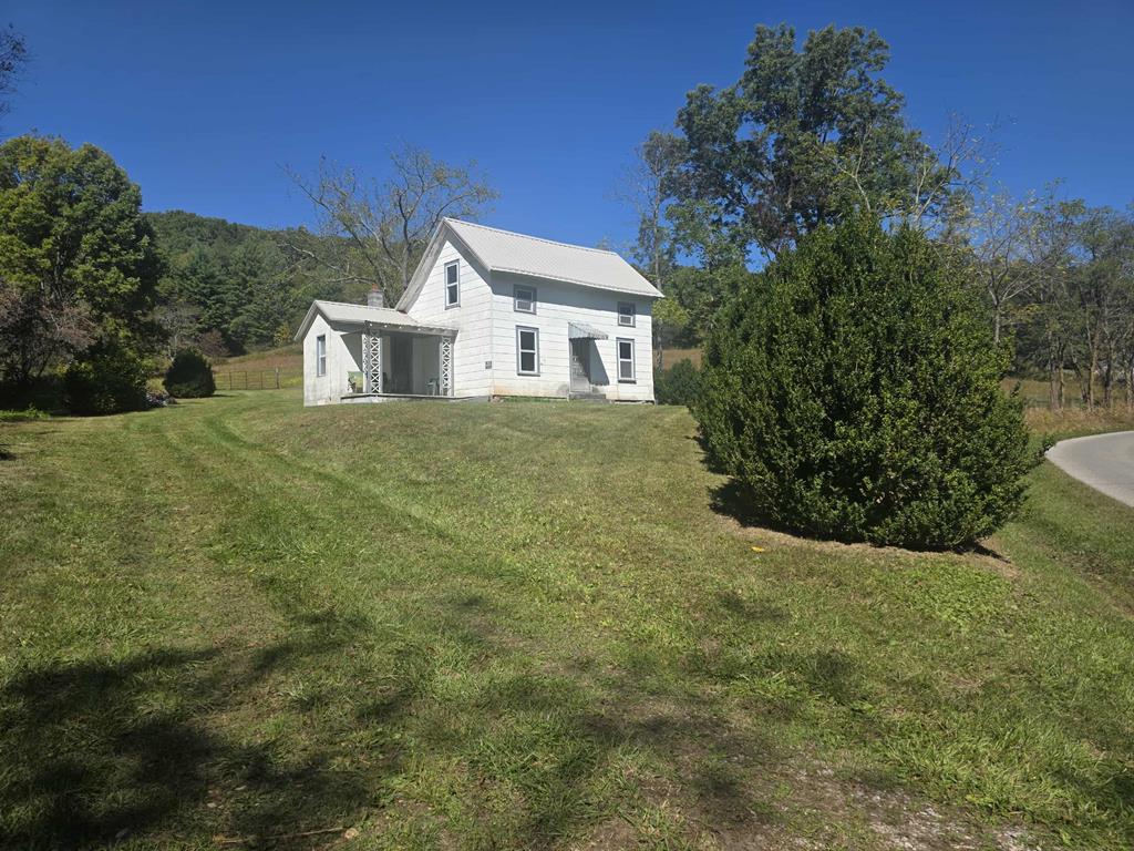 Bring your horses!  Perfect spot for a mini-farm. This beautiful 3.83 acre tract has multiple possibilities.  The existing 1920's farm house has a new metal roof.  The inside has been gutted and is ready for restoration, if that's your desire.  If you're looking for a building site, this property has several ideal locations.  Come and give this one a look and explore the possibilities.