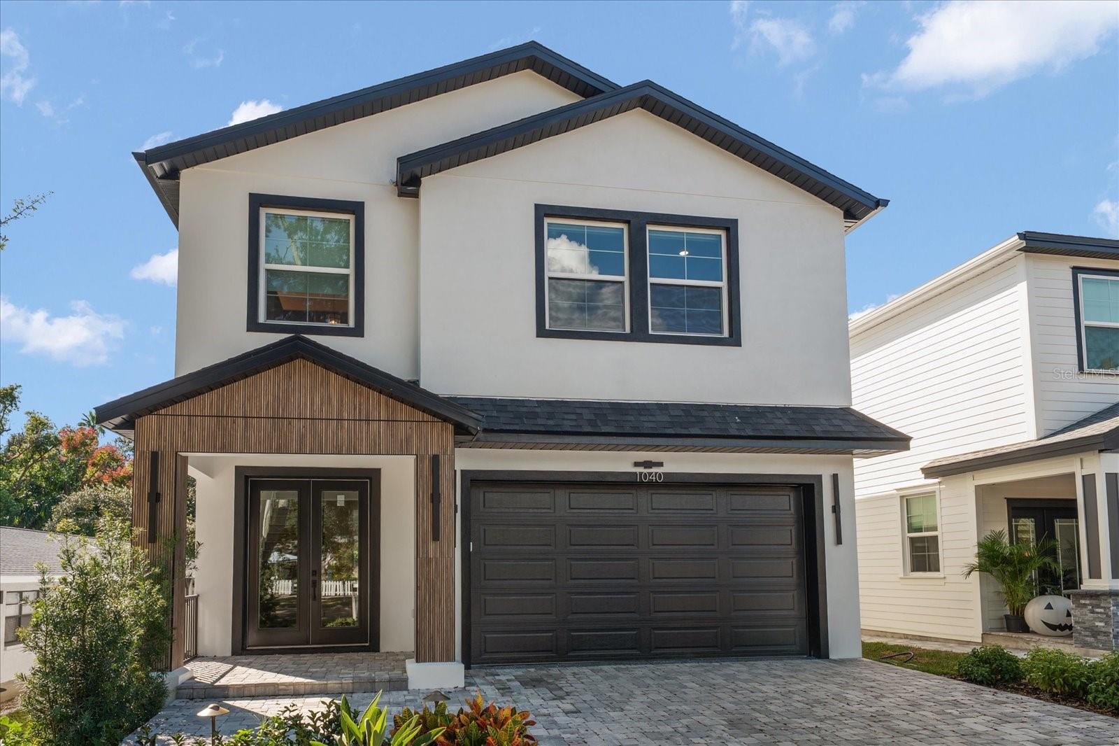 The Premise? A Brand New All Block 5 Bedroom W/4 Full Bath Custom Build Executed W/ A Level 5 Finish Meaning Textureless Walls and Ceilings, The Absolute Highest Quality Of Execution. The Locale? None Other Than The Four Corners Of Dunedin’s Crossroads, 3 MINUTES TO THE TOWNS MARINA, PARKS WITH A VENUE OF SHOPPES, RESTAURANTS AND GASTROPUBS BEFORE YOU…While Countryside and North County Are Less Than A 12 Minute Jaunt Away. Now, for this absolutely stunning 3,000 square foot modern home..From its’ exquisite front facade w/architectural styling to an unbeatable floor plan that belies a graciousness and ease of space. The first floor accesses an open Great Room where the kitchen, dining and living arena becomes one integrated space. Outfitted with a 3/4 of an inch thick hardwood floor, bathed in a neutral color palette, enveloped in Custom Italian KIOS Cabinetry, World Worthy Stainless Steel Appliances, Quartzite Counters & Backsplash, designer lighting, hardware and solid core doors await the perfectionist within. A 5th Bedroom, 4th Full Bath, Butlers Pantry and easy accessibility to a 2 Car Garage complete this 1st level whilst a stairway takes us to an upstairs landing- ideal as a secondary living or recreational space, TV viewing area, or kids bonus rec. The Super Lux Primary offers a stunning grey/black and coffee patina w/ the aforementioned custom cabinets, a mega soaking tub and volume shower with a separate water closet with smart commodes. A capacious walk-in closet offers a well scaled capacity and window, while the primary bedroom itself yields King Size bedding, and its own sitting area. Another garden facing En-Suite captures views of a burgeoning neighborhood with its very own bath. 2 More Bedrooms- one of which is also Garden facing round up the Jack n Jill concept and a shared bath. Richly defined vanities, multi layered textured tiles with modern fixtures encapsulate this masterful house n home. I await your visit, and cannot wait to hear your observations..