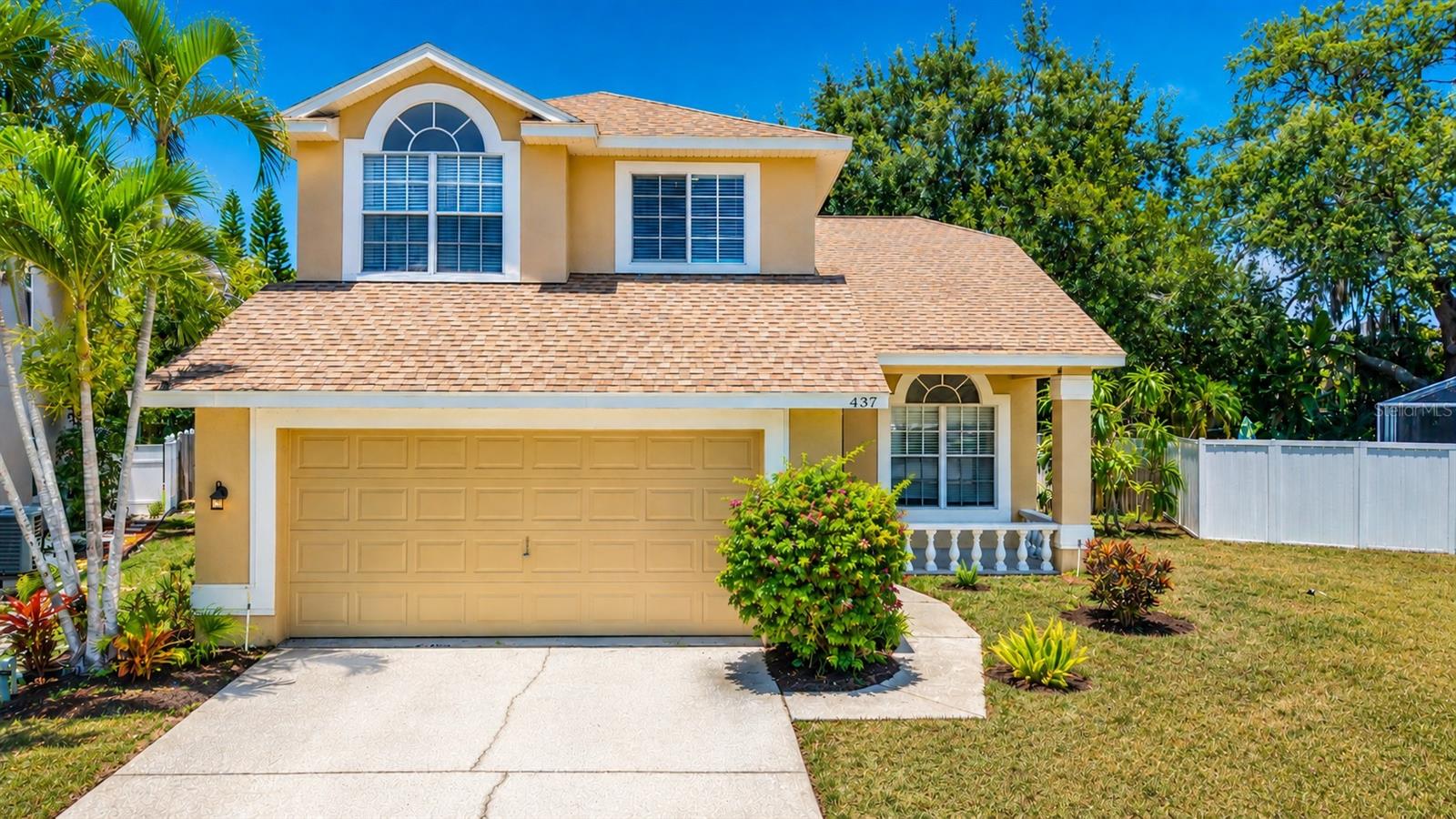 Virtually Staged. Welcome to this beautifully updated 4-bedroom, 2.5-bath pool home offering 1,770 square feet of bright, open living space in one of Tarpon Springs most desirable neighborhoods. From the moment you step inside, you'll appreciate the soaring vaulted ceilings, abundant natural light, and spacious open-concept floor plan designed for both everyday living and entertaining. The updated kitchen features quartz countertops, white shaker cabinetry, stainless steel appliances, recessed lighting, a pantry, and a breakfast nook overlooking the living area. The first-floor primary suite provides a private retreat with luxury vinyl plank flooring, direct access to the screened pool, and a beautifully updated en-suite bath complete with dual vanities, quartz countertops, and an oversized walk-in tiled shower. Upstairs, three additional bedrooms offer flexibility for family, guests, or a home office. Step outside to your own private Florida oasis featuring a screened-in pool, oversized fenced backyard, and mature tropical landscaping, creating the perfect setting for relaxing or entertaining year-round. Situated on an oversized lot, there is plenty of room for pets, play, or gardening. Best of all, this home is located in a flood zone X-500, has no CDD fees, and offers a low HOA fee. Ideally located just minutes from the world-famous Tarpon Springs Sponge Docks, Fred Howard Park, Sunset Beach, Gulf beaches, shopping, dining, golf courses, and top-rated schools, with convenient access to US-19 for an easy commute throughout the Tampa Bay area. This move-in-ready home combines stylish updates, spacious living, and an exceptional location to deliver the Florida lifestyle you've been searching for.