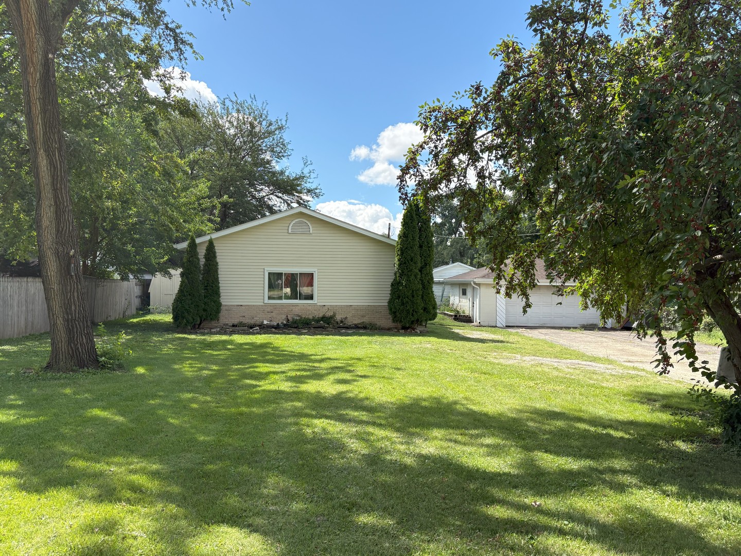 3 bedrooms, 1 bath, and 9.5-foot ceilings in the family room make this Lockport Township ranch an ideal canvas for its next owner. Set on the back of a spacious quarter-acre lot with mature trees, this home offers a sense of privacy and tranquility. Detached 2-car garage and long driveway provide plenty of storage or room for the hobbyist or car enthusiast to enjoy.  Located on a quiet street in unincorporated Lockport, the property provides the opportunity for peaceful living with convenient access to amenities.    Enjoy the best of both worlds with a suburban feel and access to excellent local amenities. Unincorporated Lockport is known for its highly rated public schools, including District 92 and Lockport 205 High School. The property's convenient location also means you are close to area parks, downtown Lockport, and transportation corridors, including Metra and I-355.    This property is priced to sell and provides a fantastic opportunity to create your dream home without starting from scratch; roof and most windows are already replaced! Customize the cosmetic touches to perfectly suit your taste and style. Don't miss your chance to own a private, single-story home with a great layout in a desirable location.  Schedule your showing today!