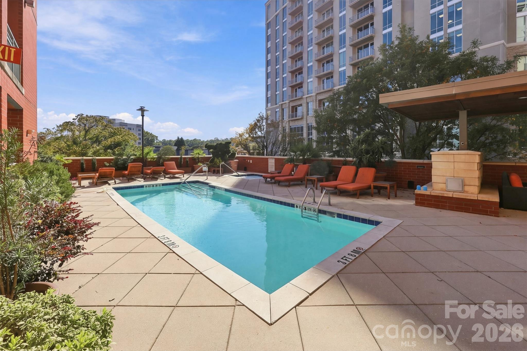 Experience elevated city living from the 7th floor of this spacious 2 bedroom/2 bathroom condo in the prestigious Royal Court, one of Charlotte's premier luxury condominium communities! Perfectly positioned in the heart of Dilworth, just moments from Uptown, South End and directly across from the Dowd YMCA, this exceptional residence offers an unbeatable combination of convenience, comfort and skyline views.Inside, an open-concept layout is enhanced by durable LVP flooring throughout the main living areas and abundant natural light. The well-appointed kitchen features granite countertops, a tile backsplash, stainless steel appliances, a gas range, bar seating and ample cabinet space, with all appliances including the washer and dryer conveying with the home. The spacious primary suite offers a covered balcony with beautiful city views, a custom walk-in closet designed to maximize storage and an elegant en-suite bath with granite and tile finishes. A generously sized secondary bedroom and full bath provide comfortable accommodations for guests, roommates or a home office.Royal Court residents enjoy an impressive collection of resort-style amenities, including a concierge, fitness center, outdoor pool and hot tub, a beautifully appointed gazebo with an outdoor kitchen and gas grill, and a secure parking garage with assigned parking. Opportunities to own a two-bedroom residence in this highly sought-after community are rare — don't miss your chance to enjoy sophisticated urban living in one of Charlotte's most desirable locations!