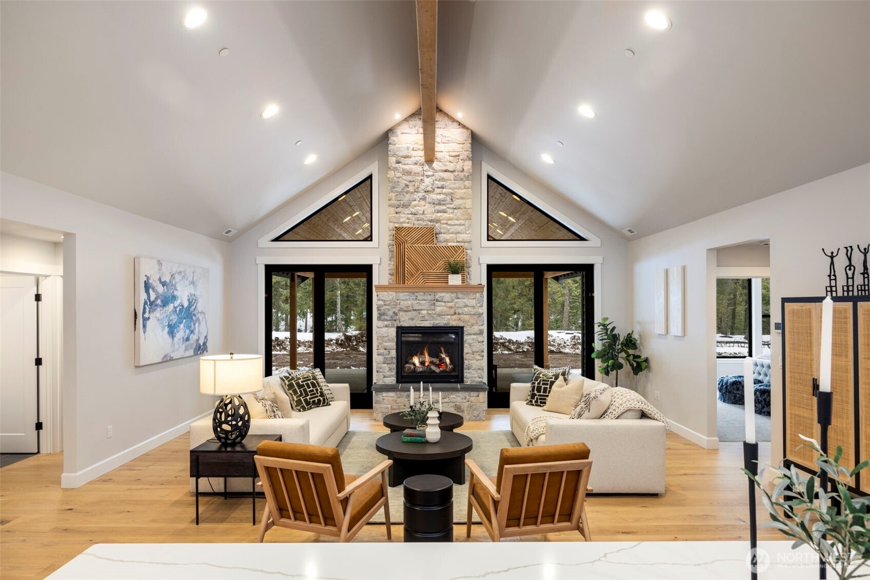 The grand open-concept living area is warm, spacious, and inviting—designed so everyone can gather and enjoy time together. An abundance of windows fills the space with natural light while showcasing the peaceful conservancy setting just beyond your backyard.