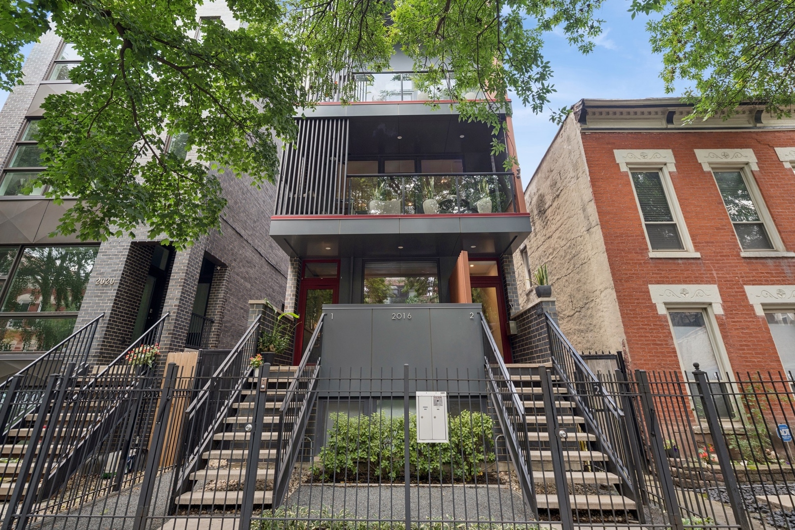 CLICK ON VIRTUAL TOUR. Discover an architecturally significant residence in the heart of Wicker Park, where contemporary design meets refined craftsmanship. This duplex-up penthouse offers a private entrance, four large balconies and an unforgettable rooftop deck.  The thoughtful floorplan centers on the art of living well.  The main level is designed for entertaining, anchored by a chef's kitchen featuring two-toned custom cabinetry, a quartzite waterfall island, and professional-grade appliances from Sub-Zero, Wolf, and Miele. The dining area accommodates a table for twelve and opens onto a covered balcony nestled among lush treetops. An expansive living room flows to an additional balcony, ideal for quiet moments or morning coffee.  The main floor also includes a tucked away powder room and a pantry closet for added function. Upstairs, all three bedrooms are filled with natural light, including a primary suite with walk-in closet, private balcony, and spa bath with soaking tub, steam shower, and radiant heated floors.  The crown jewel is the rooftop deck-a fully landscaped retreat with skyline views, electric pergola and automated blinds for on-demand shade, and 50' of window boxes. An outdoor kitchen is equipped with a grill, pizza oven, sink, dishwasher, beverage refrigerator, and ample cabinetry, creating a true open-air entertaining space. Additional highlights include hardwood floors throughout, tilt & turn windows, custom closet systems, and a 220V EV-ready garage parking.  Within blocks of this quiet, tree-lined street are dozens of vibrant restaurants, coffee shops, and boutiques.  Steps to the CTA Blue Line, 606 Bloomingdale Trail and Wicker Park's farmers market.
