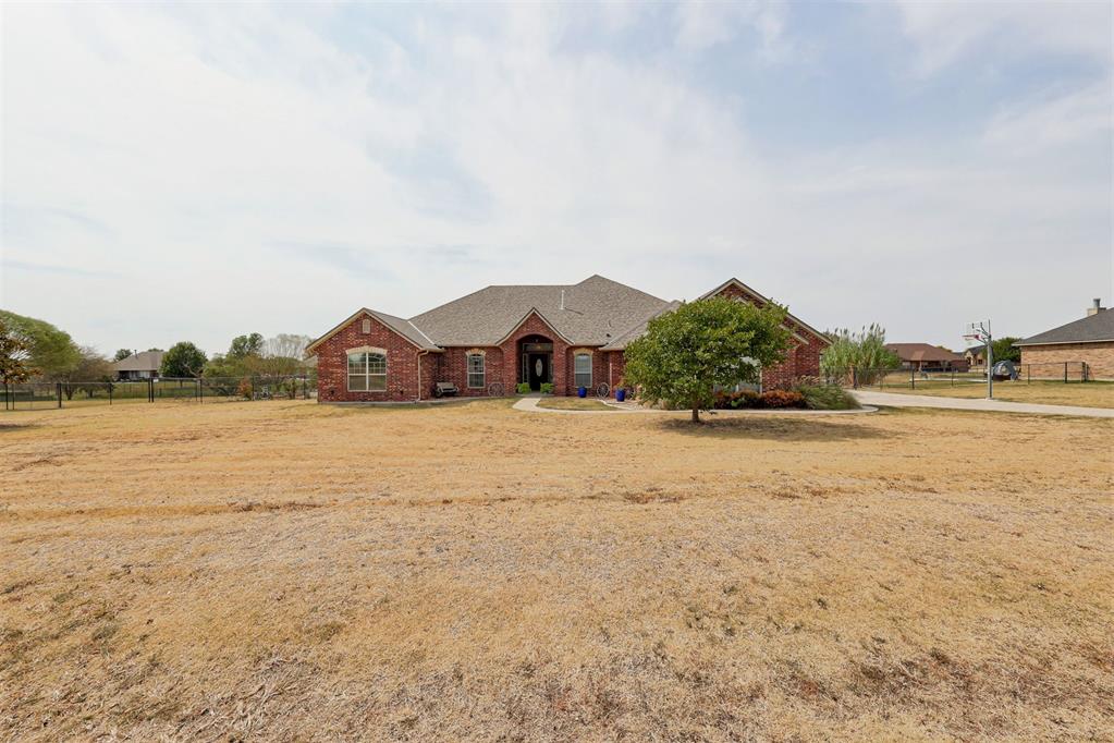Absolutely stunning custom-built situated on an expansive .99-acre lot in the award-winning Deer Creek School District! From the moment you walk in, you’ll appreciate the thoughtful design, spacious layout, & incredible attention to detail throughout. The open-concept main living area features soaring ceilings, a beautiful fireplace, & a seamless flow into the spacious kitchen, complete with stainless steel appliances, granite countertops, large island, double ovens, pantry, breakfast bar, and generous dining area. The home offers 5 bedrooms, 3.5 baths, & multiple living spaces, providing plenty of room for everyone. The custom home takes it to another level, featuring a fantastic game room with hand-scraped hardwood floors, surround sound, exposed whitewashed brick, and direct patio access. The game room opens to an additional living area with a full bath and bedroom, creating an incredible setup for entertaining, guests, a home office, or multigenerational living. Be sure to explore the hidden storage behind the built-in bookcases—there are multiple storage rooms tucked away that you have to see to believe! The spacious primary suite features a large walk-in closet, double vanities, whirlpool tub, and separate shower, while the secondary bedrooms offer excellent size and storage. Outside, the backyard is truly extraordinary. The sellers invested more than $100,000 creating an impressive outdoor oasis with extensive concrete, covered and extended patios, and abundant space for entertaining, relaxing, and enjoying the expansive lot. A shop pad is already poured, with sewer connected for RV hookup, adding even more potential and functionality. Additional features include custom cabinetry, storm shelter and water softene. Located in a neighborhood featuring a pond and play park, this exceptional property offers space, versatility, privacy, and amenities that are rarely found in one home. This is truly a one-of-a-kind opportunity you won’t want to miss!