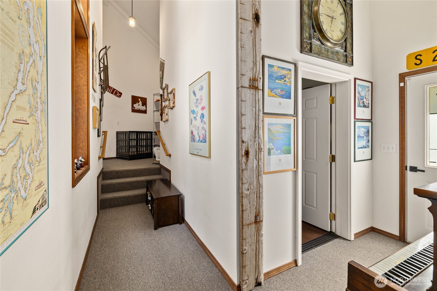 Hallway to storage room, go up stairs to mudroom and garage