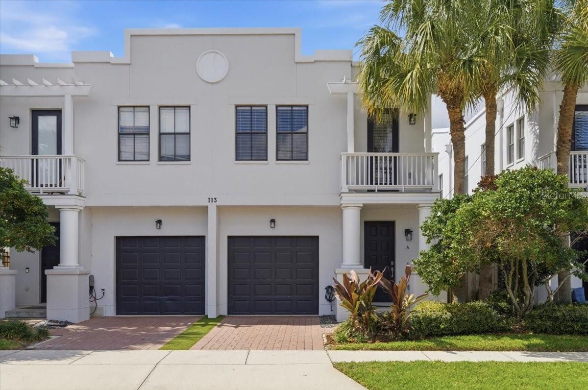 Under contract-accepting backup offers. South Tampa's most coveted zip code, a floor plan that actually fits your life, and a price point that still makes sense — 113 S. Packwood Unit A is where smart buyers land. Imagine your mornings: coffee at the breakfast bar while the open great room fills with light, kitchen flowing seamlessly into the living space — no walls interrupting the energy, just a connected layout built for real life. Whether you're meal-prepping solo or having family game night, this main level handles it all. Step through the slider to your private patio — the perfect spot to fire up the grill on a Tampa evening. Upstairs, the primary suite impresses — king-sized layout, walk-in closet, private balcony. Two additional bedrooms flex as guest room, home office, or creative space. Upstairs laundry keeps life convenient. Private one-car garage.  The highlights: 2018 roof · Freshly painted interior & exterior · Low HOA · Non-flood zone · No rental restrictions — live in it, lease it long-term, or explore your investment options. In a zip code steps from UT, the demand is built in. The unit sits directly on Packwood — no alley access — with easy parking and added everyday convenience. Step outside and you're minutes from everything that defines 33606. Walk Bayshore Boulevard at sunrise, brunch at Hyde Park Village, dinner on SoHo, catch a concert at Amalie Arena — all within minutes. The University of Tampa is right around the corner. Tampa International is 15 minutes west. This is the neighborhood people relocate to Tampa specifically to live in. Zoned for the district's top-rated schools — one of South Tampa's most valuable assets.