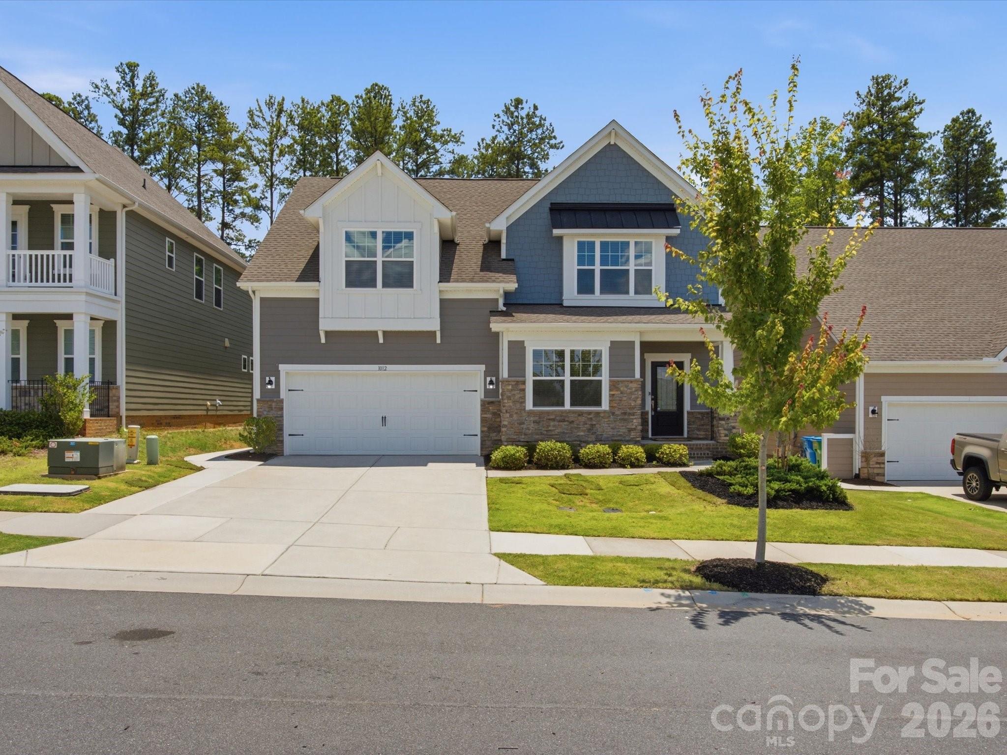 Nearly new and move-in ready, this beautifully updated home offers the perfect combination of space, style, and functionality in the highly sought-after Millbridge community. Freshly painted throughout with brand new carpet, the home features an open-concept floor plan filled with natural light. The spacious kitchen is the heart of the home, offering abundant cabinetry, an oversized pantry, and plenty of room to gather. The main-level primary suite provides convenience and privacy, while a dedicated home office is ideal for working from home. Step outside to enjoy the quiet, wooded, fenced backyard, perfect for relaxing or entertaining. Upstairs, you'll find an oversized loft, a second spacious primary-sized bedroom, two additional bedrooms, a full bath, and an abundance of storage. Tucked away on a quiet street, this home offers access to Millbridge's exceptional amenities, including resort-style pools, a fitness center, clubhouse, walking trails, pickleball courts, and more. This is one you won't want to miss!