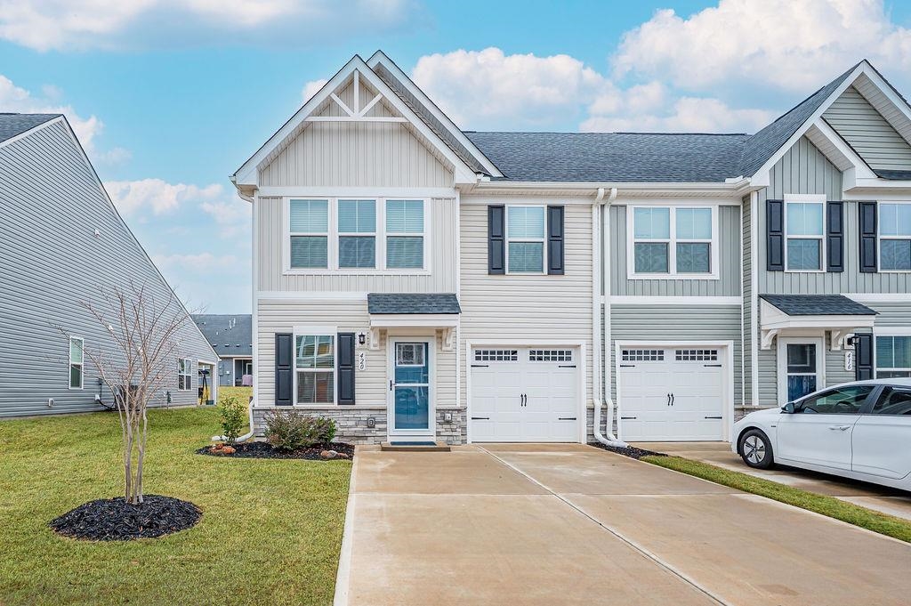 Price Improvement!! Closing cost assistance available with acceptable offer. Great opportunity to own a beautiful home! The Villas @ Arden Woods! Discover resort-style living in one of the Upstate's most desirable communities! This home is in immaculate condition! Community highlights: Junior olympic-size pool with shallow-water sunbathing area, golf cart paths throughout the neighborhood, community fishing pond, 2 dog parks, 2 playgrounds, scenic walking trails, SHOPPING AT THE SHOPS at ARDEN: Grocery, restaurants, and  other retail just steps away! Less than 5 minutes to interstate access for easy commuting! The Grand Nassau floor plan offers open-concept living with 3 bedrooms (Master suite on main), 2.5 bathrooms, and a garage with an additional two-car parking pad. Laundry on main, also! Charming cottage-style exterior and the DESIRABLE END-UNIT location provides extra natural light and privacy. Inside you'll love the warm, cozy, and welcoming atmosphere. Upgraded storm door has been added as well as blinds throughout. Kitchen has upgraded backsplash, gas range, and a TANKLESS WATER HEATER! All kitchen appliances remain INCLUDING THE REFRIGERATOR! The covered patio has been screened-in and perfect for relaxing outdoors. This home truly offers low-maintenance living in an amenity-rich community! Your own private retreat with everything you need close by. Don't miss this incredible opportunity to have your own home with the ease of maintenance free living! Schedule your showing today!