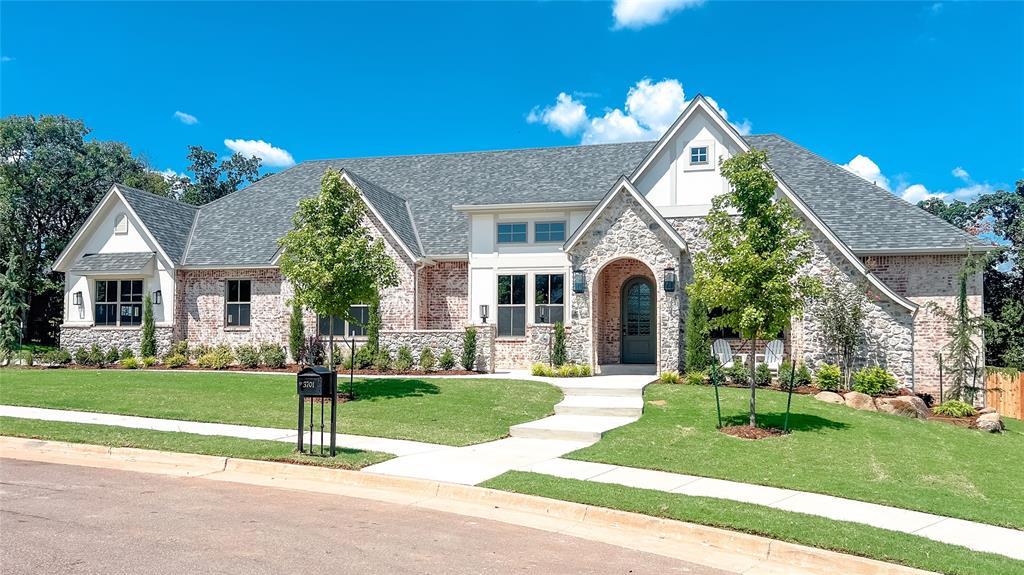 Experience the perfect blend of luxury and comfort in this half-acre, cul-de-sac homesite located in the highly desirable Town Square community of Edmond, brimming with top-notch amenities! This English Tudor-style home is designed in our Philbrook plan and offers 4 bedrooms, 3.5 bathrooms, a study, and a game room, all conveniently on one level in a cul-de-sac for privacy. The chef in your family will be delighted by the kitchen's double islands, spacious walk-in pantry, and double ovens. The study is a charming retreat with library bookcase shelving with a 14ft ceiling. Gorgeous site-finished wood flooring graces the main living areas and extends into the primary suite, which features a vaulted ceiling, separate vanities, a freestanding tub, a large shower, and two walk-in closets. Town Square is a historically inspired community offering a greenbelt with walking trails, a lake with a fishing dock, a clubhouse, a resort-style pool, a fitness center, a youth recreation center, a community garden, and a playground. Don't miss your chance to own this exceptional home in such a vibrant and welcoming community!