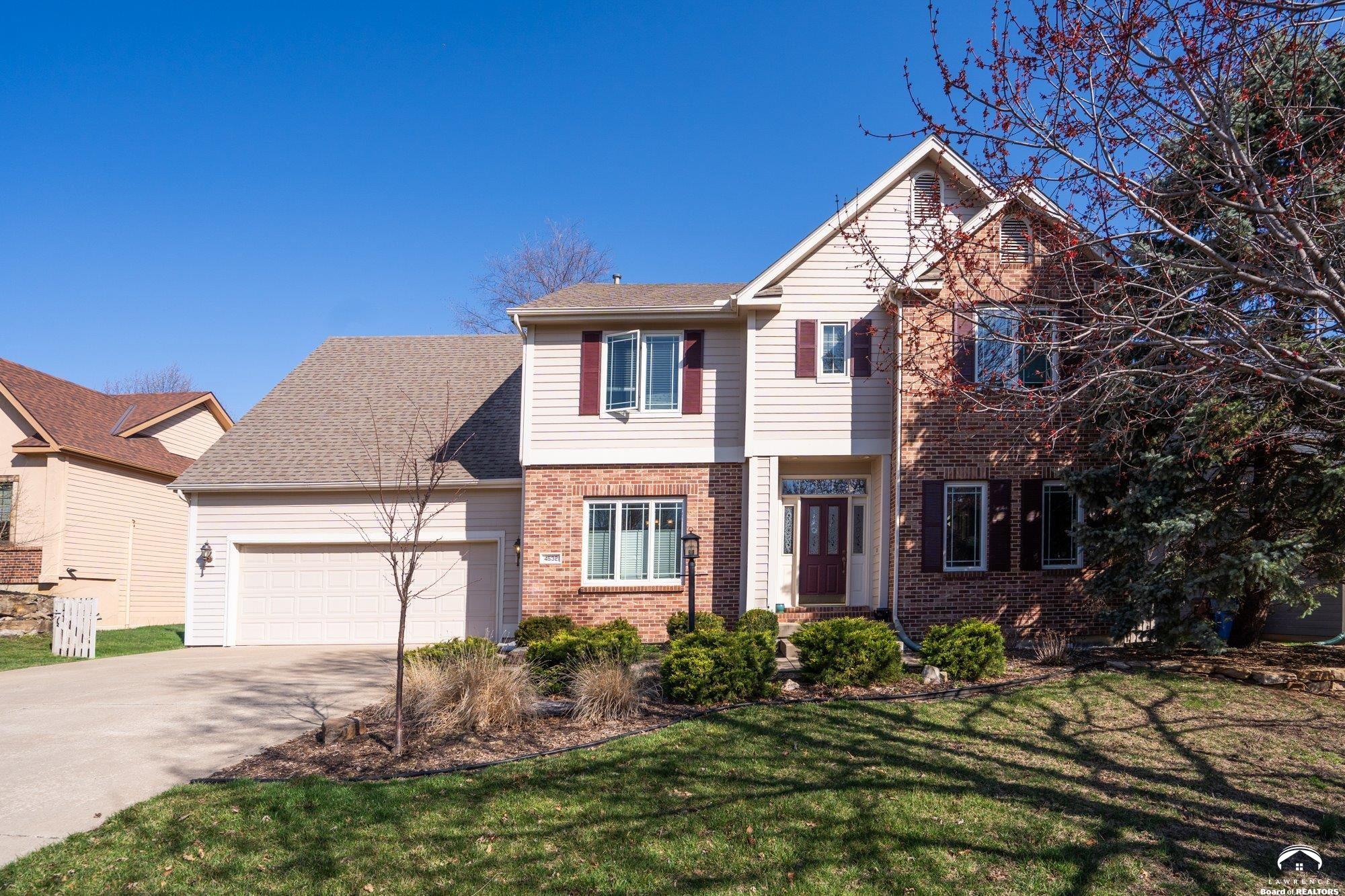 Welcome to this beautifully maintained 5-bedroom, 5-bath two-story home offering over 3,500 square feet of living space. Situated just minutes from Quail Run Elementary, Free State High School, shopping, and local restaurants, this home provides the perfect balance of comfort, space, and convenience.  The main level offers generous living areas designed for both everyday living and entertaining. Formal dining room, eat in kitchen with north facing windows showcasing the large backyard with expansive deck.   Upstairs, you'll find spacious bedrooms including a comfortable primary suite designed as a private retreat. 2 bedrooms connected with a jack and Jill bathroom and 4th bedroom complete with its own ensuite. The full daylight basement expands the living area even further, offering additional flexible space ideal for a recreation room, guest suite, home office, or workout area plus 5th bedroom and bathroom.   With its generous square footage, functional layout, and prime location near schools, parks, and amenities, this home offers a rare opportunity to enjoy both space and convenience in one of Lawrence’s sought-after neighborhoods.