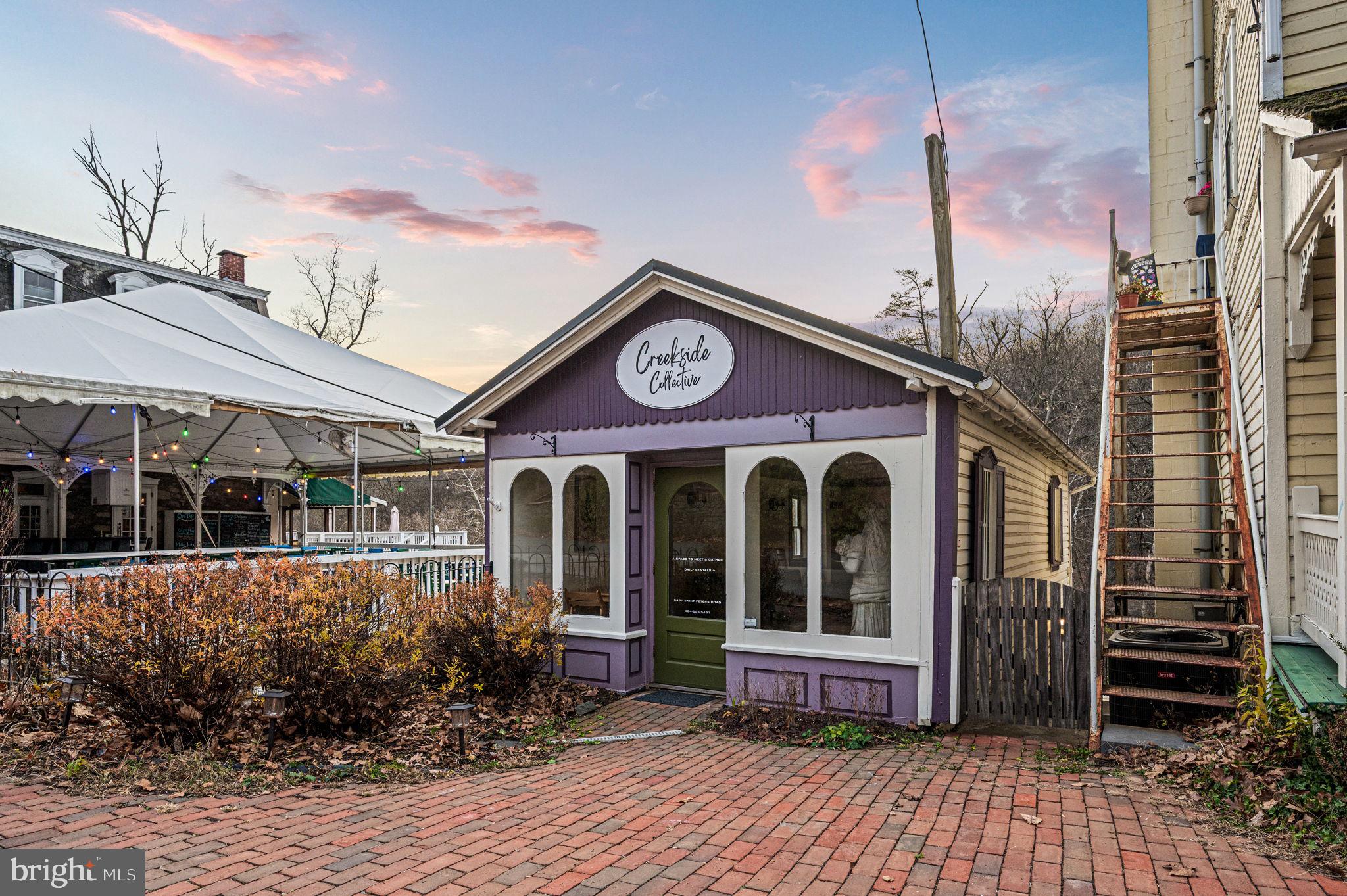 OPEN HOUSE SATURDAY 10-12! Let your imagination run wild with this truly charming commercial property nestled in the heart of historic Saint Peters Village. Dating back to 1881, this building once served as the carriage house for The Excursion House, known today as the Saint Peters Inn - an enduring piece of local history that now offers endless possibilities for its next chapter. Saint Peters Village itself is a 19th-century industrial village, just ¼ mile in length, where time seems to slow down and history is preserved at every turn. A series of colorful historic buildings line the village, now home to artisan shops, inviting eateries, a tiny cider bar, and even an old-timey arcade - a setting that truly takes you back in time. Though modest in size, the potential here is anything but. The main level features an open, sun-filled space with beautiful hardwood floors and abundant natural light - ideal for a boutique retail shop, artist studio, gallery, wellness space, or intimate event venue such as baby showers or wedding showers. Downstairs, you’ll find a convenient bathroom, and a small gathering space w/ refrigerator, offering added flexibility for a variety of uses. Step outside and you’re instantly transported. A deck and stairs lead down to French Creek, where the sound of rushing water over ancient boulders politely commands you to slow down and take a deep breath. Beyond the creek, adjoining woods and miles of scenic trails create a rare and peaceful backdrop - an experience that simply can’t be replicated. Additional highlights include a 10-year-young standing seam metal roof, providing durability and peace of mind. Parking is also plentiful, and utilities are quite reasonable. Small but special, rich with history, and surrounded by nature, this is a rare opportunity to own a space where creativity, commerce, and timeless charm intersect in one of Chester County’s most beloved villages.