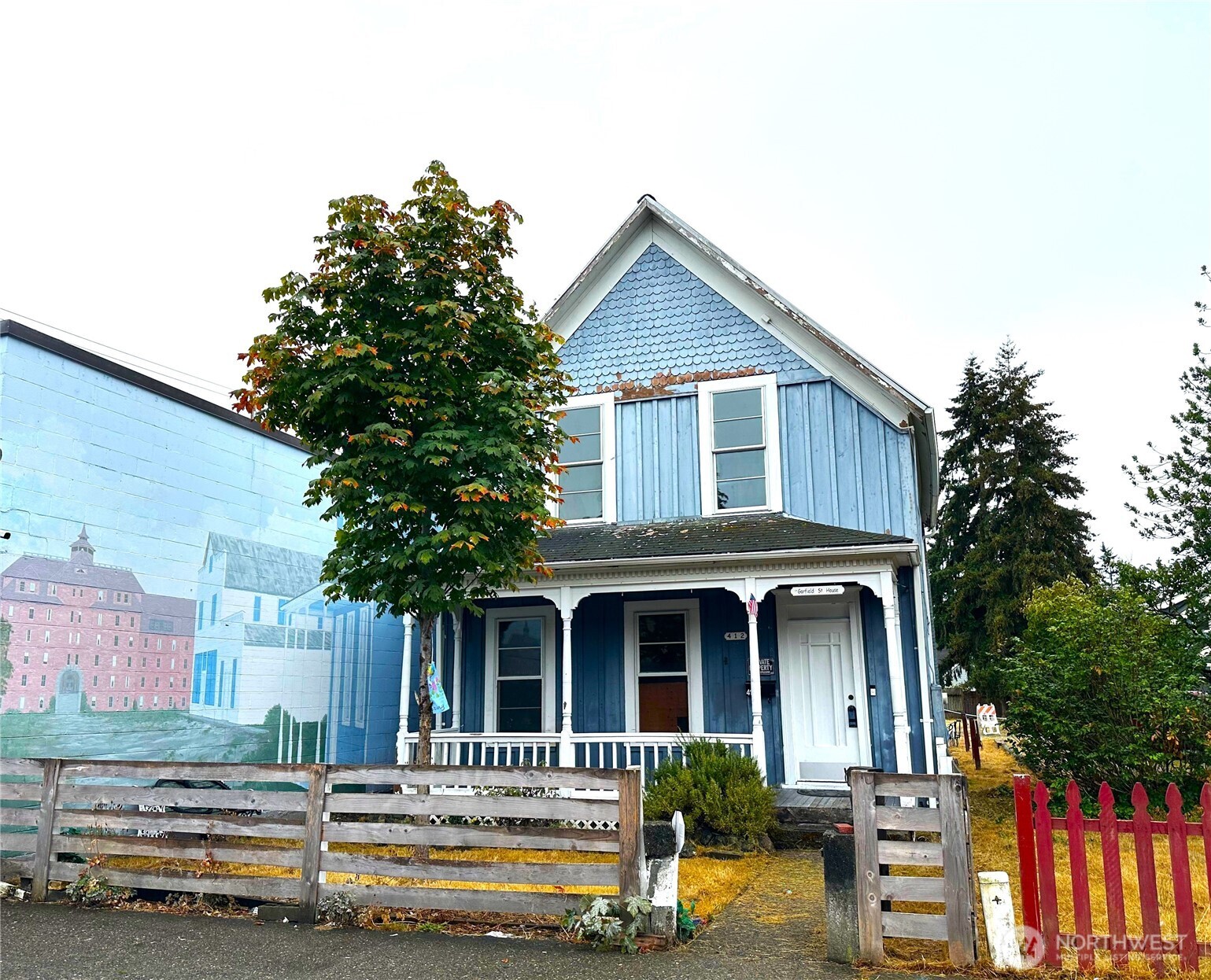Discover an exciting opportunity at 412 Garfield Street, ideally positioned in the heart of Parkland’s vibrant Garfield Street district. Located near Pacific Lutheran University, local restaurants, shops, services, and public transportation, this property offers excellent access to everyday conveniences and major commuter routes. Its central location and strong neighborhood visibility make it a compelling choice for buyers seeking value and potential in a well-connected community. 3 Bedrooms upstairs and a bathroom on each level are a feature here. Vintage, historic style front room and formal dining area with pillars and high ceilings. Original Wood stair case and railings. Zoned TCTR with last use as Commercial land with Single Family Residence. Potential for a home based business, check with the county for allowed uses. Previously used as a rental with income of $2350 per month, with tenant paying all utilities. Purchase as an investment with historic value. Featured in the Parkland historical book:"From Wilderness to Suburbia" by Richard D. Osness.  It's a one of a kind opportunity! Explore the possibilities and schedule your showing today! The exterior is currently being painted by Curb Appeal Painting. Includes a 15 foot easement for ingress and egress from the rear of the property out to 122nd St. S.
