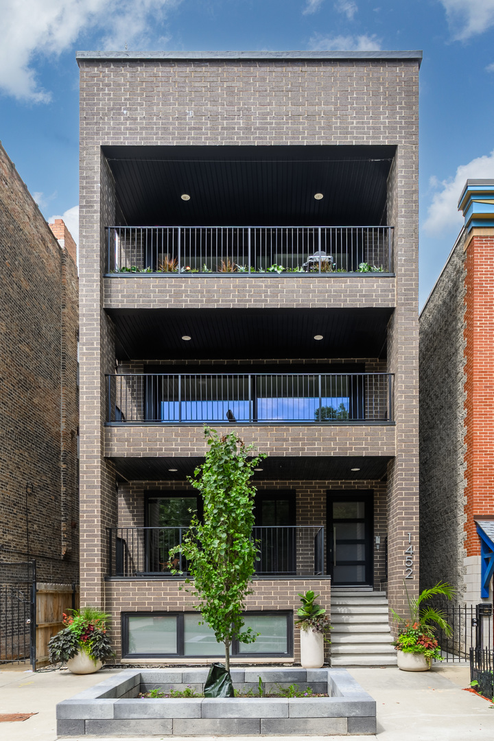 Step into refined living in this stunning Wicker Park duplex-up penthouse, set on an oversized lot on a quiet, tree-lined street. Designed for seamless indoor/outdoor living, this showstopping home features soaring ceilings, polished concrete heated floors, in-ceiling Sonos surround sound, and an impressive wall of sliding glass doors that flood the space with natural light. The chef's kitchen is a dream, featuring a walnut live-edge island, Dekton countertops, an Artemide kitchen light fixture, Miele and Fisher & Paykel appliances, and abundant storage - all flowing effortlessly into the open living and dining areas, which open directly onto a spacious private deck -perfect for morning coffee or unwinding in the evening. The main level also includes a serene primary suite with a spa-inspired bath featuring a walk-in shower and soaking tub, along with a large walk-in closet. The home also includes a high-end steam humidifier system - an upgraded addition that enhances air quality and comfort year-round. Upstairs, you'll find three additional bedrooms with generous closet space and large windows, as well as a second family room with a custom built-in wet bar that spans the entire wall and serves as a true statement piece. Step outside to one of the home's most impressive features: a sprawling private rooftop oasis, built for entertaining. This outdoor retreat includes an electric pergola, built-in gas grill, two outdoor refrigerators, Paloform outdoor fireplace, Roca tiles, perimeter lighting, and an outdoor dog run (on both levels) - making it feel like your own private lounge in the heart of the city. The location offers easy access to Milwaukee, North Ave, Division, and is within walking distance to Wicker Park. You're also just steps from renowned restaurants, coffee shops, bakeries, the 606 Trail, CTA transit, and more. One garage parking space included-this is a rare opportunity to own a one-of-a-kind home designed for both comfort and style.