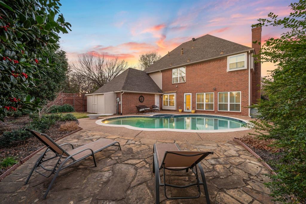 Welcome home to this beautifully updated and meticulously maintained stunning two-story home, nestled on a corner lot in the prestigious Willow Creek community of Bedford. Thoughtfully designed, this home features four spacious bedrooms, three and a half baths, and a private home office ideal for remote work, study, or a quiet retreat. Step inside to an open-concept living space anchored by a cozy fireplace and an abundance of natural light streaming through walls of windows that were replaced in 2023. The chef’s kitchen is both stylish and functional, showcasing granite countertops, timeless white cabinetry, stainless steel appliances, and a generous walk-in pantry, perfect for everyday living and entertaining alike. The expansive primary suite offers a serene escape with a spa-inspired ensuite, remodeled in 2024, features a luxurious freestanding soaking tub, oversized walk-in shower, designer cabinetry, quartz countertops, and upscale lighting finishes. Step outside to a true backyard retreat, where a heated diving pool and spa are surrounded by mature landscaping and an updated wood privacy fence, creating the perfect setting for relaxation or hosting guests year-round. *LOCATED ON POWER GRID* offering added peace of mind during outages. Ideally situated near premier shopping, dining, and entertainment, with convenient access to DFW International Airport, this exceptional home blends comfort, style, and an unbeatable location.