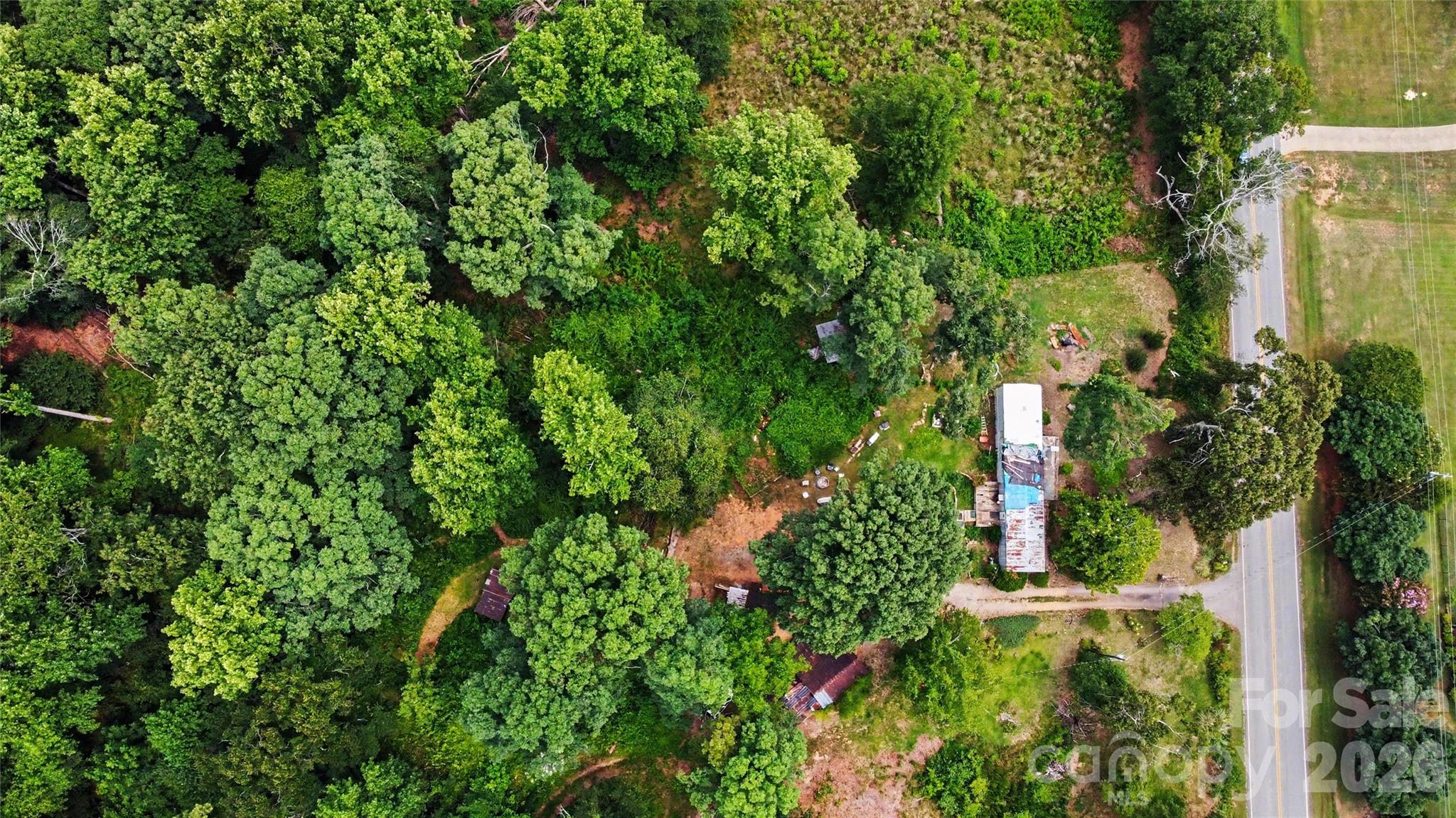 Rare opportunity to own over 5 acres in one of Upstate South Carolina’s fastest-growing corridors! Ideally located just minutes from the BMW Manufacturing campus and Hoover facilities, this property offers convenient access to Greer, Duncan, and major highways. Public water is available, and an existing septic system is already on site, providing added value for future development. A mobile home currently sits on the property and conveys at no value. Zoning permits mobile homes, offering flexibility for a replacement home, investment property, or future plans. Whether you’re looking to build, invest, or establish a homesite with acreage, this property presents endless potential in a highly desirable location.