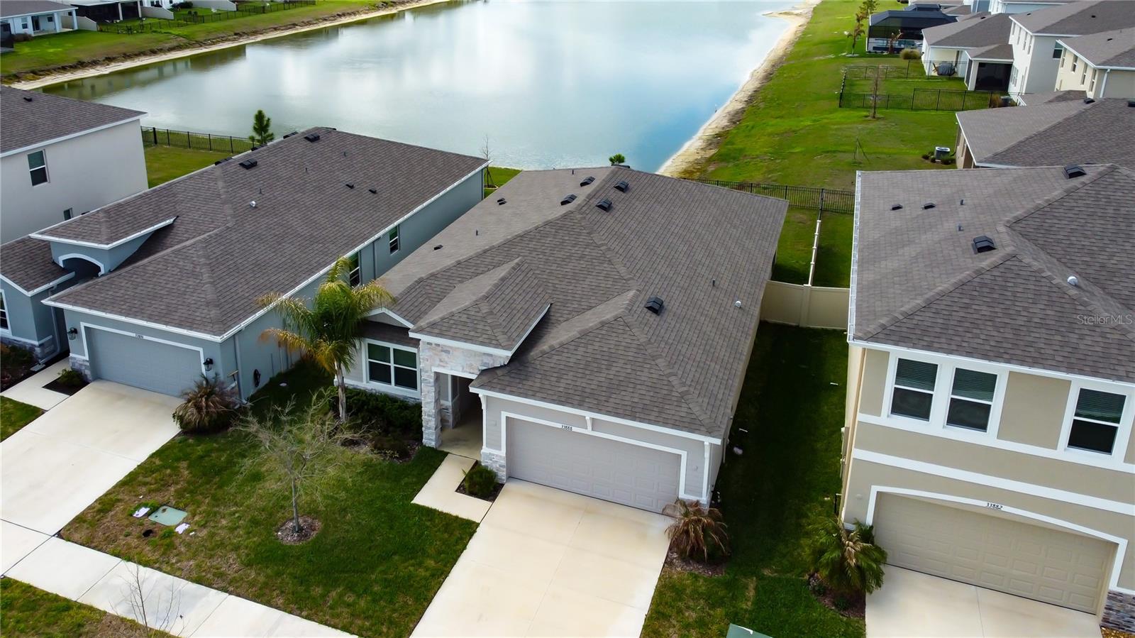 Welcome to the highly desirable Avalon Park community! This beautifully designed home has been custom interior-designed with stylish upgrades throughout, offering a perfect blend of comfort, elegance, and functionality. With 3 bedrooms, 2 full bathrooms, and a spacious 2-car garage, this home is ideal for effortless everyday living.The bright, open floor plan creates a welcoming atmosphere, seamlessly connecting the living and dining areas to the modern kitchen. The kitchen is thoughtfully designed with granite countertops and stainless steel appliances, making it perfect for both daily use and entertaining.Step outside to a picture-perfect water view and enjoy breathtaking sunsets that create the perfect backdrop for relaxing evenings and peaceful mornings. The backyard offers a fully fenced backyard—an ideal space for weekend gatherings or simply relaxing under the Florida sunshine.As a resident of Avalon Park, you’ll enjoy access to resort-style community amenities including a beautiful clubhouse, sparkling pool, playground, and a dedicated dog park for your furry friends—all included in the HOA. Conveniently located near parks, shopping, dining, and everything Avalon Park has to offer, this home delivers the perfect combination of lifestyle, comfort, and convenience.