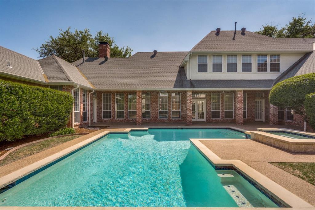 Welcome to this stunning executive home in the highly sought-after Harrington Homeplace, located in top-rated Plano ISD. Perfectly positioned in the heart of West Plano, this custom residence offers the ideal blend of luxury, functionality, and everyday comfort. This beautifully designed 5-bedroom home features a dramatic entry, an open floor plan, and abundant natural light throughout. Rich hardwood floors, two fireplaces, and a wet bar create an inviting atmosphere for both relaxing and entertaining. The gourmet kitchen is the heart of the home, complete with granite countertops, a 5 burner gas cooktop, double ovens, built-in refrigerator, under-mount sink, extensive cabinetry, a built-in hutch, and a butler’s pantry. It opens seamlessly to the main living areas, making it perfect for hosting gatherings or enjoying time with family. The thoughtfully designed layout includes three bedrooms downstairs, offering flexibility for guests or multigenerational living. Split formals and an oversized dining room provide elegant spaces for entertaining.Step outside to your private backyard oasis featuring a sparkling pool with spa, a covered patio, and a large grass area, ideal for outdoor living, play, or quiet evenings at home. Additional highlights include a circle drive, custom details throughout, and a spacious layout designed for both everyday living and entertaining. Ideally located near premier shopping, dining, outstanding private school options including Prince of Peace, John Paul II, All Saints, along with convenient access to Jesuit and Ursuline and H-E-B, this home offers convenience along with a luxury lifestyle in one of West Plano’s most desirable communities.