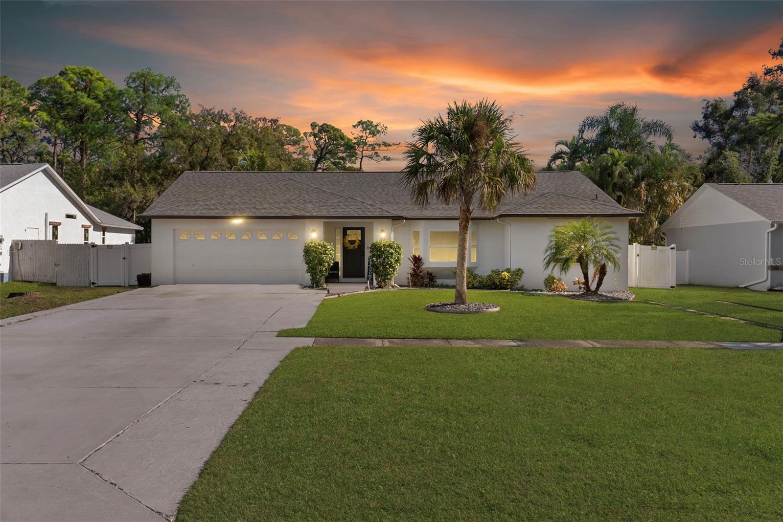 Welcome home to this 3-bedroom, 2-bath, 2-car garage residence located in the desirable Cedar Woods neighborhood of Pinellas Park. Set on a spacious, fully fenced lot backing to protected wetlands, this home offers exceptional privacy with no rear neighbors and peaceful natural views.The west-facing property delivers stunning sunset views and features an enclosed rear patio, fire pit, and ample space with pool potential, making it ideal for outdoor entertaining or future customization. The oversized yard provides flexibility for relaxation, recreation, or expansion.Inside, enjoy an airy, open-concept layout anchored by a chef’s kitchen that flows seamlessly into the living area—perfect for everyday living and hosting. Thoughtful upgrades include hurricane impact doors and windows (2022), updated plumbing, AC (2021), and roof (2021), offering peace of mind and improved energy efficiency.Conveniently located near shopping, dining, and major roadways like I-275 and US-19, making commutes and errands convenient. This move-in-ready Pinellas Park home combines privacy, functionality, and long-term value in a sought-after setting.
