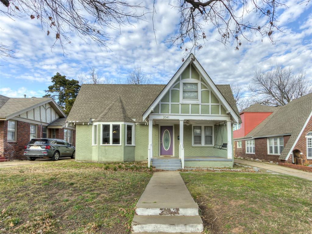Welcome to this charming 3 bed, 2 bath home in the heart of Gatewood, just minutes from OCU and everyday conveniences. Inside, original wood floors and two distinct living areas offer flexibility for relaxing, entertaining, or working from home. One living area features a cozy wood-burning fireplace, adding warmth and charm to the space.The updated kitchen combines modern function with classic style and includes a large pantry for extra storage. Downstairs, a versatile bonus room can easily serve as a home office, game room, or workout space and includes a laundry area with a full-size stacked washer and dryer that can remain with the home. The downstairs bath features a jetted tub, while the upstairs bath showcases original tile that adds timeless character. Outside, enjoy a fully fenced backyard and a detached one-car garage for parking or additional storage. With its flexible layout, thoughtful updates, and prime Gatewood location, this home offers comfort, character, and convenience all in one.