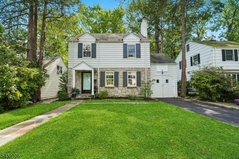 Welcome to the charming and beautifully maintained colonial in Westfield's desirable Franklin School neighborhood. Thoughtfully designed with a natural flow from room to room, the home features beautiful wood floors and timeless character throughout. The inviting living room offers a wood-burning fireplace with classic mantel and built-in bookcases while the dining room showcases a charming built-in corner cupboard and opens to the kitchen with space for eat-in dining. A versatile bonus room with direct access to the backyard rounds out the first floor and is perfect for a secondary living space. Upstairs, three bedrooms and a full bath include a spacious primary bedroom with a walk-in closet providing lovely storage. A finished and newly updated walk up attic adds even more flexible living space, ideal for guests, play area or a home office.The newly renovated finished basement provides additional usable space, complete with an updated bathroom, laundry area, flex space and a kitchenette for easy hang outs and chill time. Step outside to enjoy the private, fenced yard featuring a large bluestone patio, storage shed and custom playhouse...an inviting setting for relaxing, entertaining, and everyday enjoyment. Ideally located near downtown Westfield, schools, parks, and NJ Transit, this charming Westfield Colonial offers character, flexibility, and convenience. A true Westfield gem that you'll need to see for yourself!