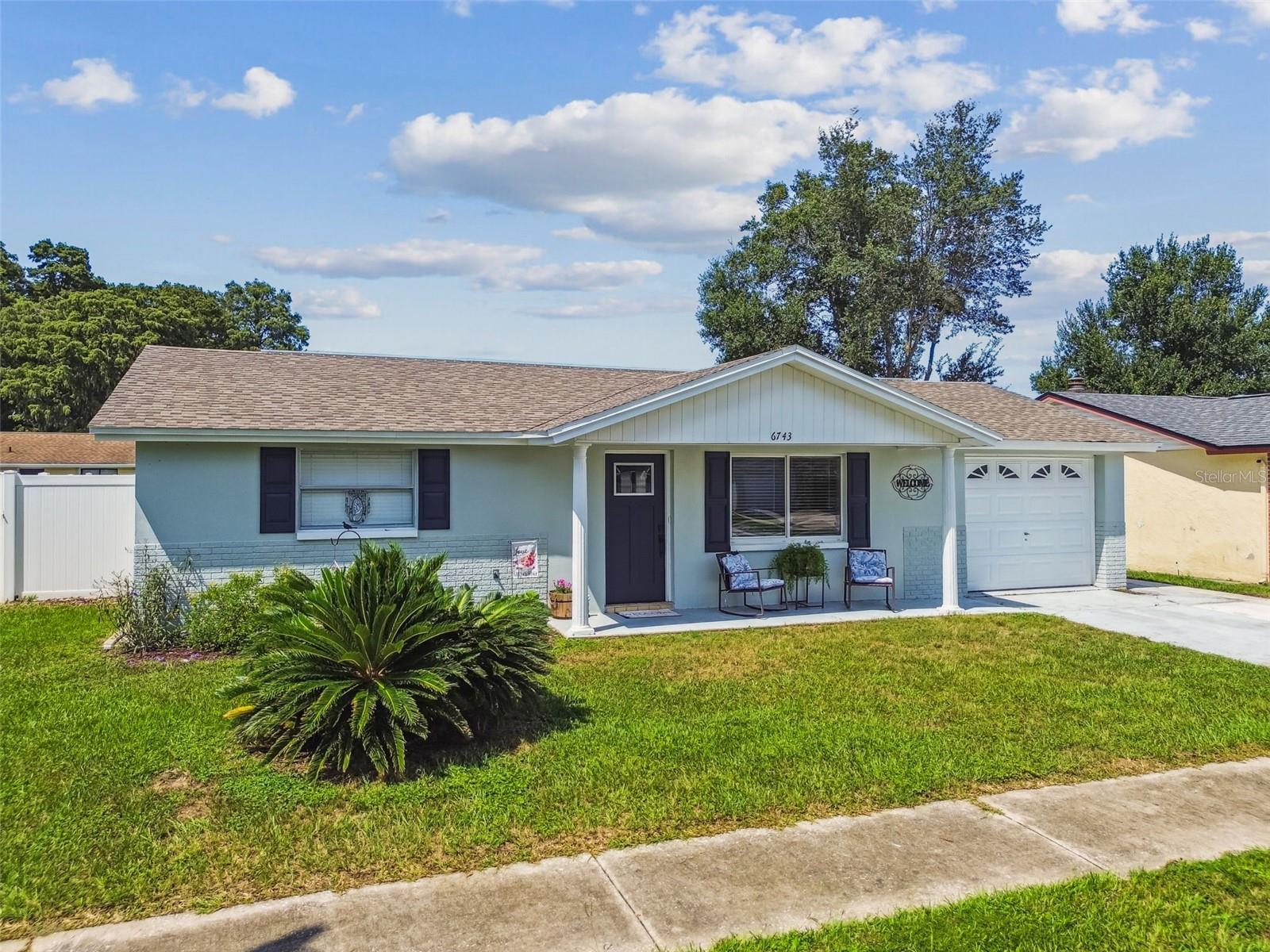 Don’t miss the opportunity to own this well-kept and fully remodeled property that you can call home.  Great for a family, first home or as an investment.  Spacious layout, with luxury vinyl flooring, updated kitchen and bathrooms with wood cabinets and quartzite counters.  Ample living room.  Master bathroom with dual shower; traditional shower and rain shower head.  Well-lit 3rd room with French doors that could be used as a office/den, gym or just for relaxation room.   A screen lanai to enjoy with family and friends over for gathering.  Great sized backyard fully fenced with vinyl fence for privacy and enjoyment.  This house is moving ready.  No HOA, Flood Zone X, No CDD