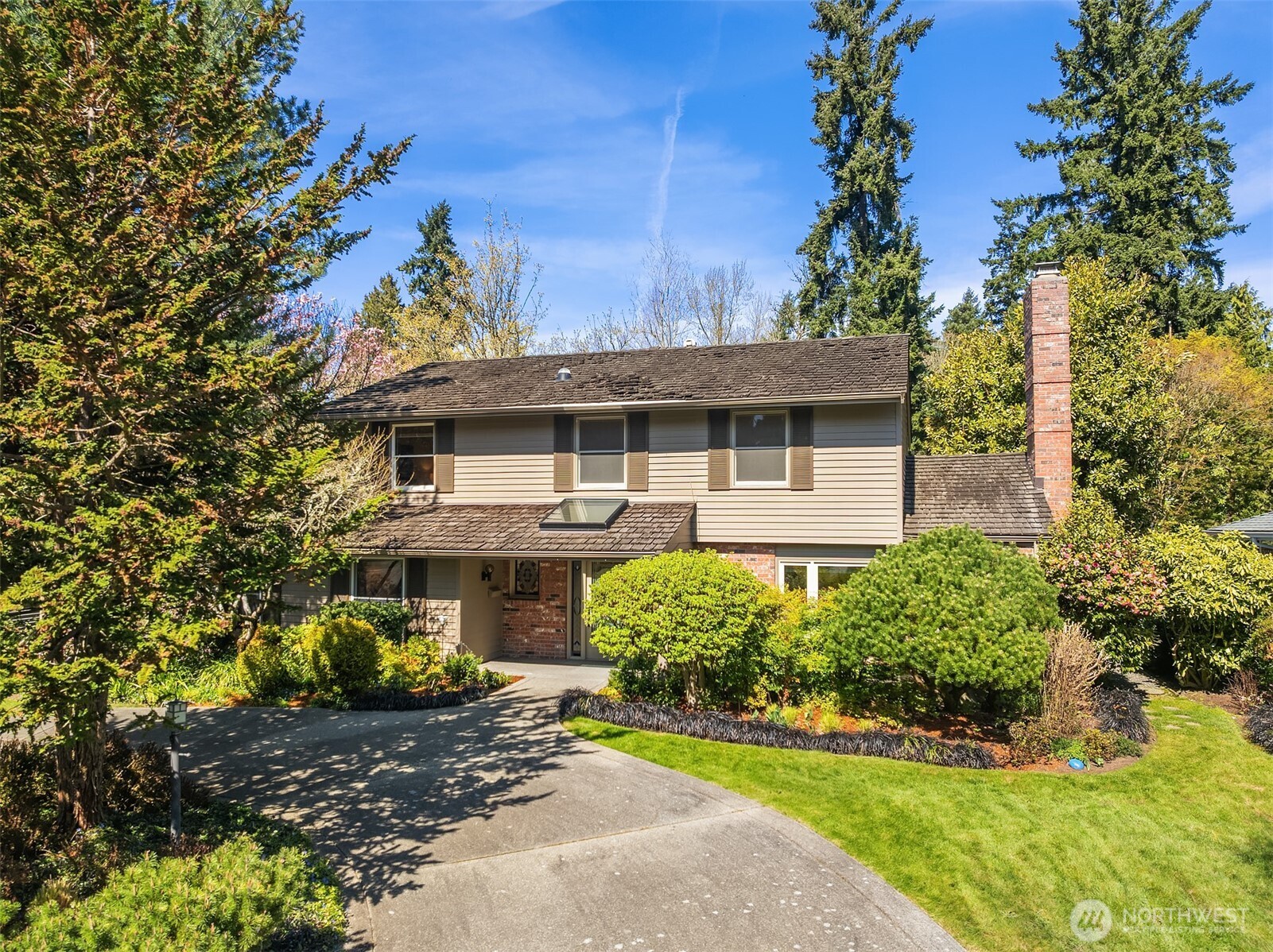 Set on a lot backing directly to Island Crest Park, this 3,000+ SF home offers immediate access to miles of wooded trails, while remaining just a short walk to Island Park Elementary and the south end shopping center with QFC, Starbucks, and more. Cherished by the same owners for more than 50 years, the property reflects continuity of care and pride of ownership. Notable features include a private office with cedar siding and built-ins adjoining the primary suite, a recently remodeled primary bath with walk-in shower and walk-in closet, and custom furniture that will remain. Upstairs are 3 bedrooms plus a landing area with easy potential for a 4th bedroom, while the existing layout also allows for potential conversion to a second primary suite. Updates include complete PEX replumbing, new Lennox furnace and A/C in 2024, a natural gas-plumbed generator, and professionally landscaped grounds with sprinkler system. An oversized garage with shop space adds versatility to this home.