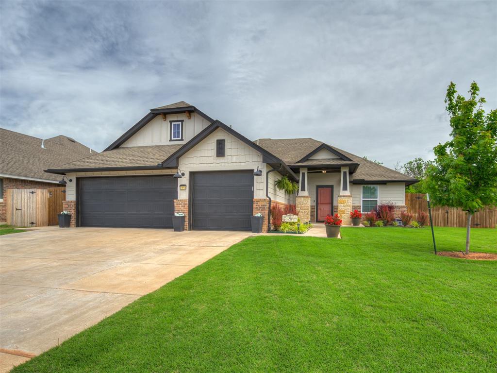 Beautiful like-new, move-in ready home situated on a spacious homesite backing to a wooded area for added privacy and no close rear neighbors. The exterior features a full cedar privacy fence with wide pickets and steel posts, full-yard sprinkler system, gutters, Anderson storm door, and an oversized in-ground storm shelter located in the garage. Additional features include attic decking for convenient storage, 2-inch faux wood blinds in the bedrooms, and oversized rear-facing windows that bring in abundant natural light while showcasing peaceful backyard views. Smart home amenities include exterior security cameras, doorbell camera, and a digital thermostat with app-controlled functionality. Inside, the thoughtfully designed floor plan features a tray ceiling with wood accents in the entry, coordinated stained wood finishes, and custom built-ins including a mud bench, primary closet dresser, and secondary bedroom desk. The kitchen is ideal for both everyday living and entertaining, offering a craftsman-style island with decorative legs and trash pullout, along with a large walk-in pantry providing exceptional storage.