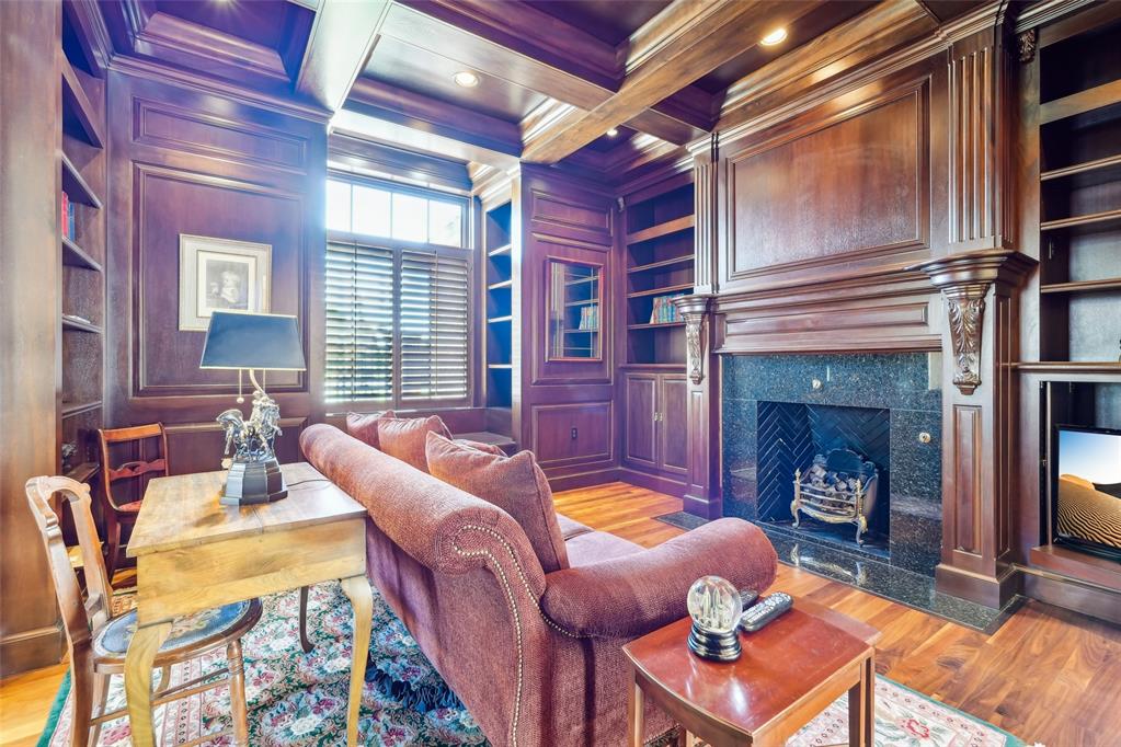 Entering the grand foyer, you are greeted by soaring ceilings and custom wood flooring with intricate 'Wange' inlays—setting a tone of elegance and craftsmanship throughout. Expansive archways lead into a refined library, richly appointedwith dark-stained Mahogany wood, creating a warm and sophisticated atmosphere. Ideal for entertaining, the formaldining and living rooms flow seamlessly into a custom bar area, all framed by expansive bay windows that offerpicturesque views of the surrounding landscape. The kitchen is a enthusiast’s dream, featuring granite countertops,generous cabinetry, and built-in display cases for china and crystal. A high-end gas cooktop, electric double ovens, and acentral island complete this well-appointed space. Adjacent to the kitchen, the Sun Room is bathed in natural light andhighlighted by a charming chandelier—perfect for formal or casual gatherings. A distinctive late 1800's hotel door with acustom wooden vanity from Austria adds a unique touch, while the utility room includes space for a small office area foradded functionality. The master suite is a private sanctuary, with French doors opening to a secluded patio. The masterbath includes a hidden vanity, a spacious garden tub, separate shower, and a private toilet area, complemented bya generous walk-in closet. Upstairs, a versatile bonus room awaits, complete with built-in wooden cabinetry, office desk,and a three-quarter bath with a walk-in shower—ideal for use as a home office, media room, or guest suite. Two additional bedrooms share a well-appointed Jack and Jill bathroom, providing both privacy and comfort for family or guests. Outdoors, the covered patio features a concealed entertainment center-offering a perfect space for alfrescorelaxation. Topping it all is a durable and elegant DaVinci roof, installed just five years ago, ensuring lasting quality and peace of mind. This home exemplifies timeless design, luxurious detail, & exceptional livability.