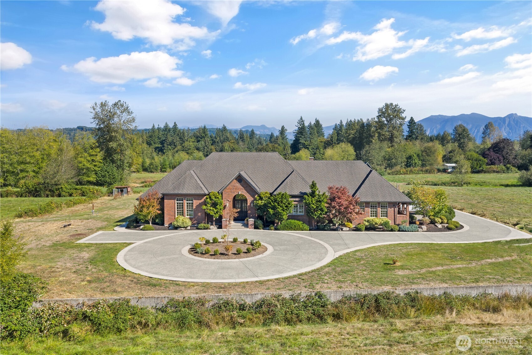 Extraordinary legacy property in Fall City. A rare offering. A trophy parcel spanning 37.11 rolling acres in a prime location - not flood plain! Mountain views, multiple pastures, salmon stream and outbuildings. Equestrian potential. Flexibility of space and use. Stately brick main home is one level, tall ceilings & open floor plan. Additional charming original 1905 farmhouse with 3 bedrooms, 1.5 baths and 1780 sf. 66'x60' barn with flexible spaces. Centrally located close to Issaquah, Redmond, Bellevue. Just minutes to I-90. Prized Snoqualmie Valley schools. Pre-inspected. Agricultural tax classification for savings. Room to roam. Let your imagination run wild. Rarely found acreage of this size. Endless possibilities. Live your dream here!