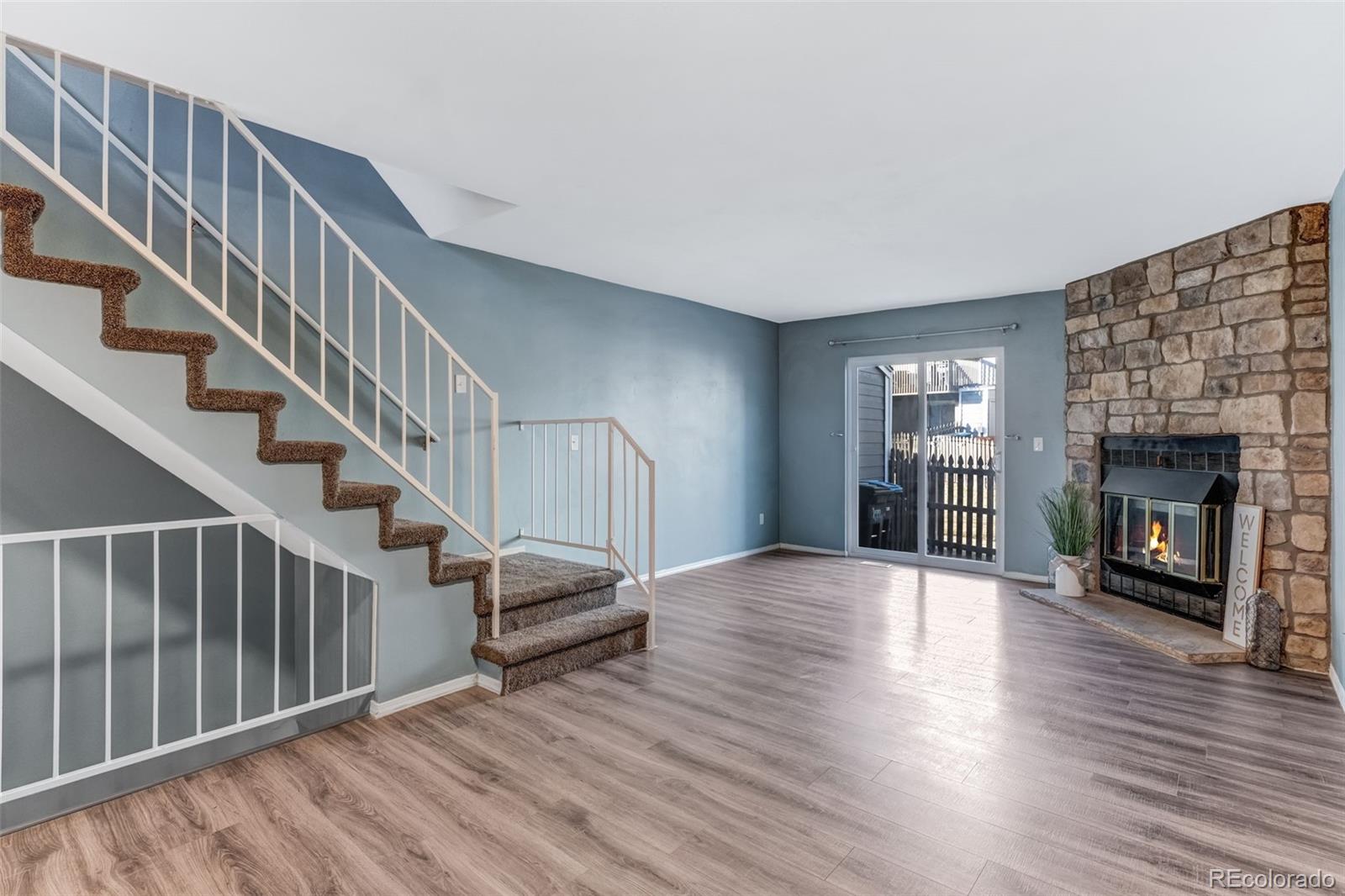 Fantastic, Low-Maintenance, 3 Bedroom, 2 Bath Townhome Conveniently Located to Bear Creek Lake Park for Hiking, Biking, Swimming & Boating, Bear Creek Greenbelt with Miles of Trails, Fox Hollow Golf Course and Red Rocks Amphitheater!  Note the Flexible & Open Main Floor Living/ Dining & Kitchen Layout with Wood-burning Fireplace for Colorado Winters.  Private Patio is Fully Fenced and is HOA Approved to be Expanded to Include a Larger Grassed Area with New Fencing Spring of 2026!  Upstairs Bedrooms Boast Large Windows Full of Natural Light and Vaulted Ceilings.  Discover a 3rd Bedroom with Beautiful Built-Ins, an Updated Bathroom, and a Large Utility/ Storage Room with Washer & Dryer Hookups in the Basement. Neighborhood is Surrounded by Mature Landscaping Offering a Playground, Pool and Basketball Courts for Downtime & Personal Enjoyment, Dog Stations Throughout & Social Events to Foster Connection. Worry-Free Parking as HOA Allows Up to 3 Vehicles Per Unit with 1 Reserved Spot and 2 Additional Open Spaces.  Additionally, No Current Restrictions on Short-Term or Long-Term Rentals!