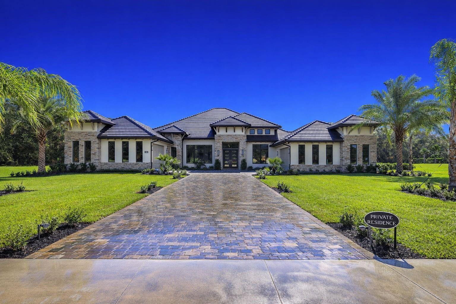 Virtually Staged. Modern Luxury Meets Old Florida Serenity at The Estates at Brown's Landing. Experience a rare blend of architectural mastery and natural tranquility in this custom-built 1.6-acre sprawling luxury estate. Situated on a private cul-de-sac bordering the protected Spruce Creek ecosystem, this 4,023 sq. ft. residence offers a ''country'' feel with a location that keeps you minutes from everything.  Featuring 4BR, 4.5 baths, home office, designated exercise room, 4 Car Garage, Pool, Spa, and so much more.  Step through contemporary front doors into a home defined by exquisite fixtures, thoughtful lighting, and refined architectural details. The open-concept layout features oversized rooms and an overall feeling of grandeur.  In the Great Room, soaring ceilings with wood beams and a stunning stacked stone wall create a sophisticated yet warm focal point for entertaining.Modern Luxury Meets Old Florida Serenity at The Estates at Brown's Landing.  Experience a rare blend of architectural mastery and natural tranquility in this custom-built 1.6-acre sprawling luxury estate. Situated on a private cul-de-sac bordering the protected Spruce Creek ecosystem, this 4,023 sq. ft. residence offers a ''country'' feel with a location that keeps you minutes from everything.  Featuring 4BR, 4.5 baths, home office, designated exercise room, 4 Car Garage, Pool, Spa, and so much more.  Step through contemporary front doors into a home defined by exquisite fixtures, thoughtful lighting, and refined architectural details. The open-concept layout features oversized rooms and an overall feeling of grandeur.  In the Great Room, soaring ceilings with wood beams and a stunning stacked stone wall create a sophisticated yet warm focal point for entertaining.