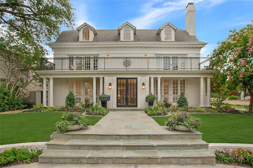 Commanding attention on its gorgeous 66’ x 150’ corner lot in prestigious University Park near Centennial Park, Curtis Park, University Park Pool, and the Volk Estates, this custom-built classic traditional home masterfully blends timeless architecture with refined transitional style and has been previously featured in Architectural Digest. The stately three-story brick home, with its Gambrel roof and surrounded by manicured landscaping and blooming crepe myrtles-offers a seamless blend of classic charm and elevated, transitional style-delivering effortless luxury from the very first glance. 
Step inside to soaring 10-ft. ceilings, rich hardwoods and an expansive central hall that anchors elegant entertaining spaces and intimate retreats. The formal living room, with its limestone fireplace and French doors, opens to a private outdoor oasis. Both with light-filled French doors opening to the outdoors, a formal dining room leads to a scenic side patio and a richly appointed library opens to a front porch-adding to the home’s dignified charm. The chef’s kitchen dazzles with white Carrara marble, a Wolf commercial range, and premium appliances-think SubZero, Thermador, Asko and Hoshizaki-flowing seamlessly into a cozy breakfast nook. With French doors opening to a front porch, the downstairs primary suite is a tranquil escape with its gorgeous spa-like white quartz and porcelain tile bath & custom walk-in closet. Upstairs, an oversized den, sitting room, 4 spacious bedrooms & a private guest suite with its own bath & adjacent kitchen offer space & flexibility. The 3rd floor reveals a game room, mirrored gym or playroom & a full bath-easily convertible to a 7th bedroom. Outside, a serene pool & spa-complete with soothing fountains, color-changing LED lights & surrounded by turf grass & honed limestone-invite relaxation & entertainment year-round. A 2-car garage with sliding gate completes this rare offering-an effortlessly elegant home in the heart of University Park.