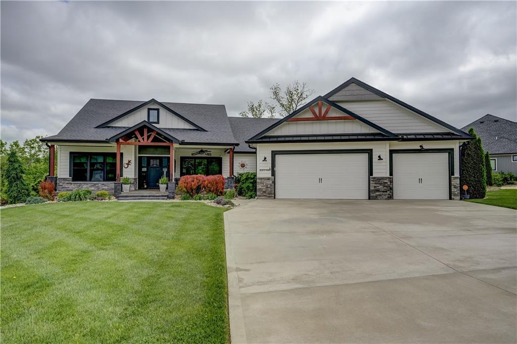 Experience lake living with this stunning reverse 1.5-story home, perfectly positioned on a desirable second-tier lake lot with convenient dock access. Packed with fully loaded upgrades, this home blends luxury, comfort, and functionality at every turn. Inside, you’ll find two spacious living areas, ideal for entertaining or relaxing, along with the rare bonus of two master suites, offering flexibility for guests or multi-generational living. The custom kitchen is a true centerpiece, featuring a large island, high-end finishes, and thoughtful design that flows seamlessly into the main living space. Step outside and take in the lifestyle this home offers—two screened-in decks provide peaceful spaces to enjoy the outdoors, while the custom oversized patio is perfect for gatherings and summer nights around the firepit. A large front porch welcomes you home, surrounded by a beautifully landscaped yard designed for both curb appeal and enjoyment. Retreat to the spa-like master bathrooms, complete with luxury jet shower packages, heated tile floors that creates a private oasis feel. Laundry on both levels for convenience to dual suites.  Additional highlights include a walkout basement, spacious 3-car garage, and energy-efficient solar system. This home truly has it all—style, space, and an unbeatable lake lifestyle.