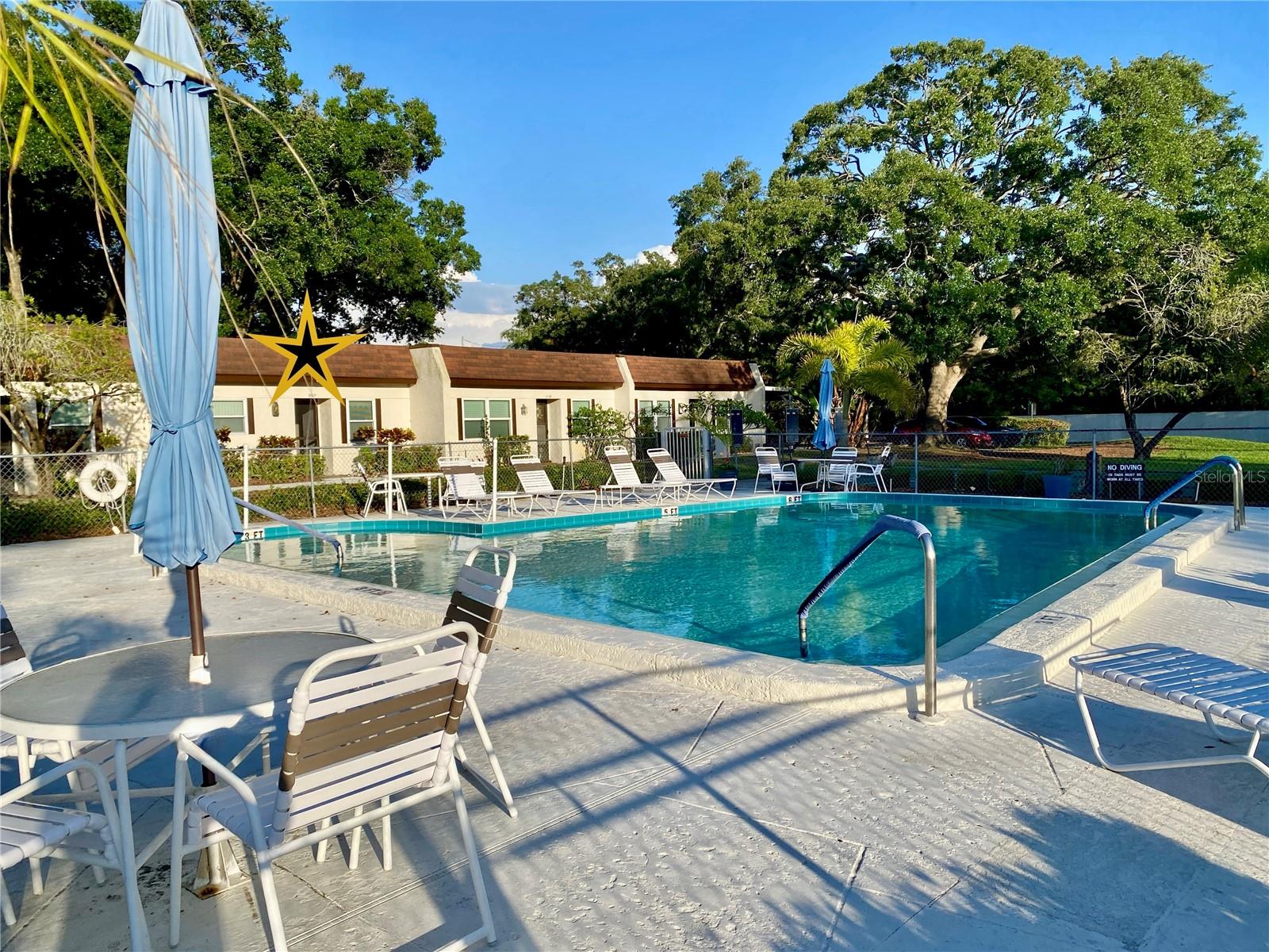LOWEST PRICED 2 Bedroom in FANTASTIC HIGHLAND LAKES - GOLF is INCLUDED in the LOW $164 a month HOA FEE!  This POOLSIDE Villa with CARPORT, Large STORAGE LOCKER features a BRAND NEW HVAC! DOUBLE PANE WINDOWS! UPDATED ELECTRICAL PANEL! and FRESHLY PAINTED! Neutral 18-inch CERAMIC Tile in the living room and bedrooms that blends seamlessly with any decor. A Spacious feel with a kitchen pass-through that OPENS to the Dining Area, Living room, and into an enclosed Florida Room with Vinyl Windows (for year-round enjoyment). The Florida Room overlooks peaceful green space, which is expandable by building an Outdoor Patio (with Four 12-inch pavers). The 2nd Bedroom with a walk-in closet also looks over the pool. Enjoy a refreshing swim as the sun sets over the pool, with the sun streaming right into your kitchen and guest bedroom/office. The CARPORT has a LARGE STORAGE LOCKER, which fits a Kayak, bicycle, etc. Some units have converted the smaller closet into a space for a Washer/dryer, although the community machines are right next to the pool.  Located in the back of the complex, so there's less road noise, and in a NON Evacuation zone, & Flood Insurance is not required. This is a fabulous opportunity to buy into the vibrant 55+ community of HIGHLAND LAKES on LAKE TARPON with all of its Amazing Amenities. GOLF for "FREE" on 3 Executive Golf Courses, PICKLEBALL, TENNIS, BOCCE, Shuffleboard, PLUS STORE YOUR BOAT or RV for FREE, Cruise on PONTOON Boats, enjoy the HEATED POOLS and SPA, try your hand at Stained-glass, Ceramics, or build a birdhouse in a full Wood Working Workshop. With over 40 other clubs, there's always something to do. Best of ALL, it is ALL INCLUDED in the LOW monthly HOA fee of $164.00! The monthly maintenance fee of only $628 covers the Roof, Insurance, Water, Sewer, Trash, Cable TV, Internet, and ground Maintenance. Giving you the FUN, EASY-LIVING FLORIDA LIFESTYLE, Highland Lakes, where RECREATION MEETS RELAXATION!