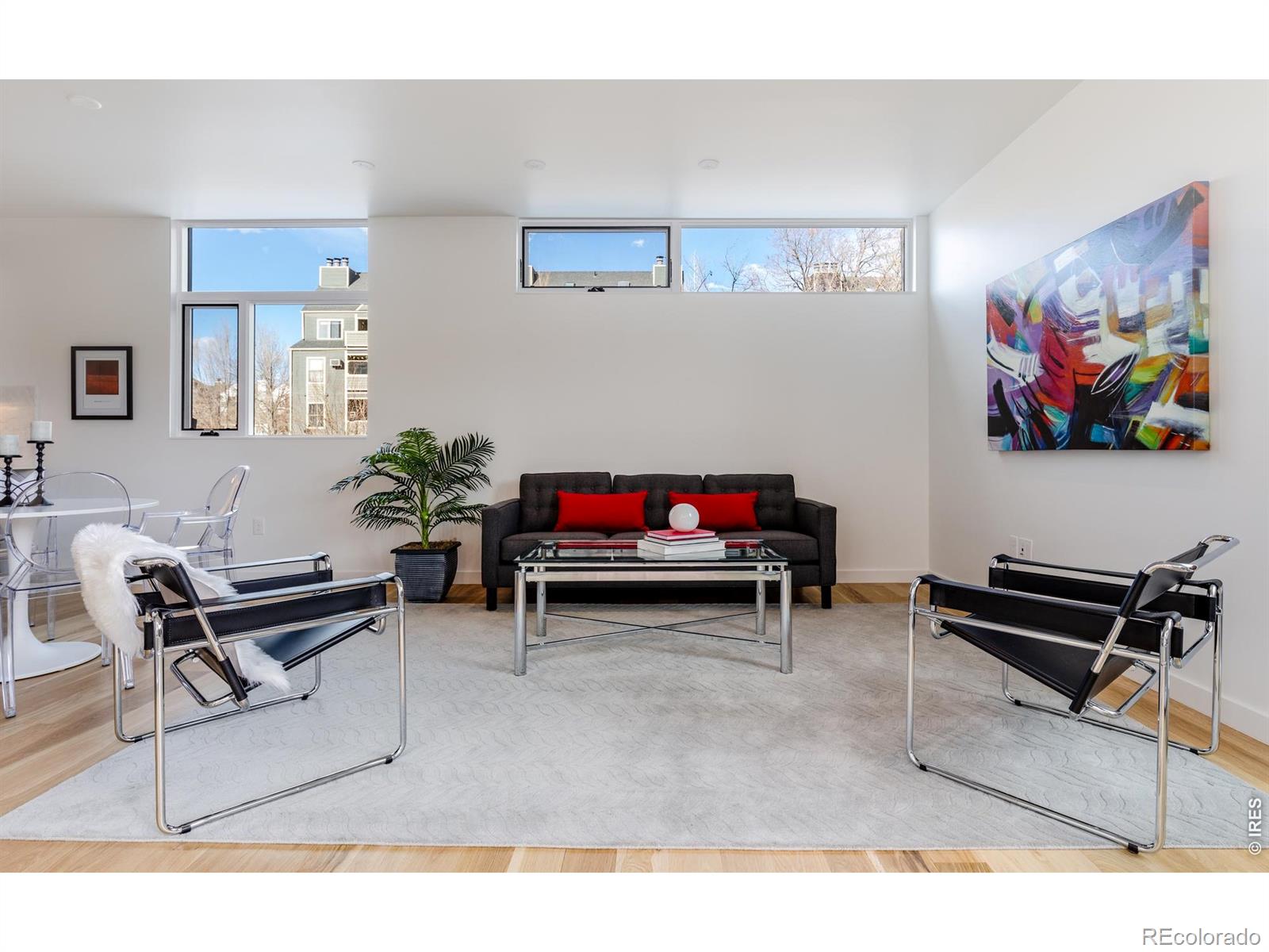 A truly exceptional offering at The Mark, this rare stand-alone residence redefines downtown Boulder living with the privacy and presence of a single-family home. With no shared walls, a detached one-car garage, and an expansive 640 SF private yard, this is an unmatched opportunity to own a refined, lock-and-leave retreat just steps from Pearl Street. Bathed in natural light, the home showcases elevated design and impeccable finishes throughout. The chef's kitchen is a statement in both style and function, featuring premium Thermador appliances, custom cabinetry, and sleek Caesarstone countertops-seamlessly opening to an airy, open-concept living and dining space ideal for both intimate gatherings and sophisticated entertaining. The primary suite is a luxurious sanctuary, complete with a generous walk-in closet and a spa-inspired bath designed for relaxation and indulgence. A well-appointed second bedroom and additional baths offer versatility for guests, work, or lifestyle needs. Designed for seamless indoor-outdoor living, multiple private outdoor spaces-including the rare, oversized yard and private upper level deck-create a serene escape in the heart of Boulder. Ample storage and turnkey convenience further elevate the experience. Distinctive, private, and effortlessly elegant-this is one of Boulder's most coveted and unique residences.