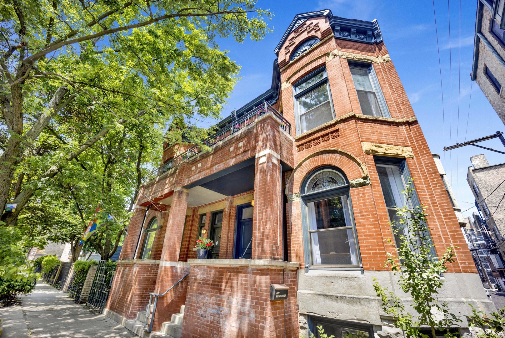 Not to be missed, this extra special vintage row home in a charming Lincoln Park location checks all the boxes.  This home features lovely architectural detailing with high ceilings, tall windows, a stately wood burning fireplace, and grand arched doorways.  Gracious main level boasts large living room and separate dining room and a sleek kitchen with large island plus seating, greenhouse window and eating area that opens to a renovated lovely back deck area.  Upstairs there are three generous bedrooms with high ceilings and two full baths, including an extra large primary suite that has lots of closet space, a spa-like ensuite bath and quaint outdoor balcony.  The lower level features spacious family room, two bedrooms, full bath, 2nd fireplace and handy kitchen.  Single garage plus an extra outdoor parking space is included. This row home is part of a three unit condominium association that also shares additional outdoor patio space.