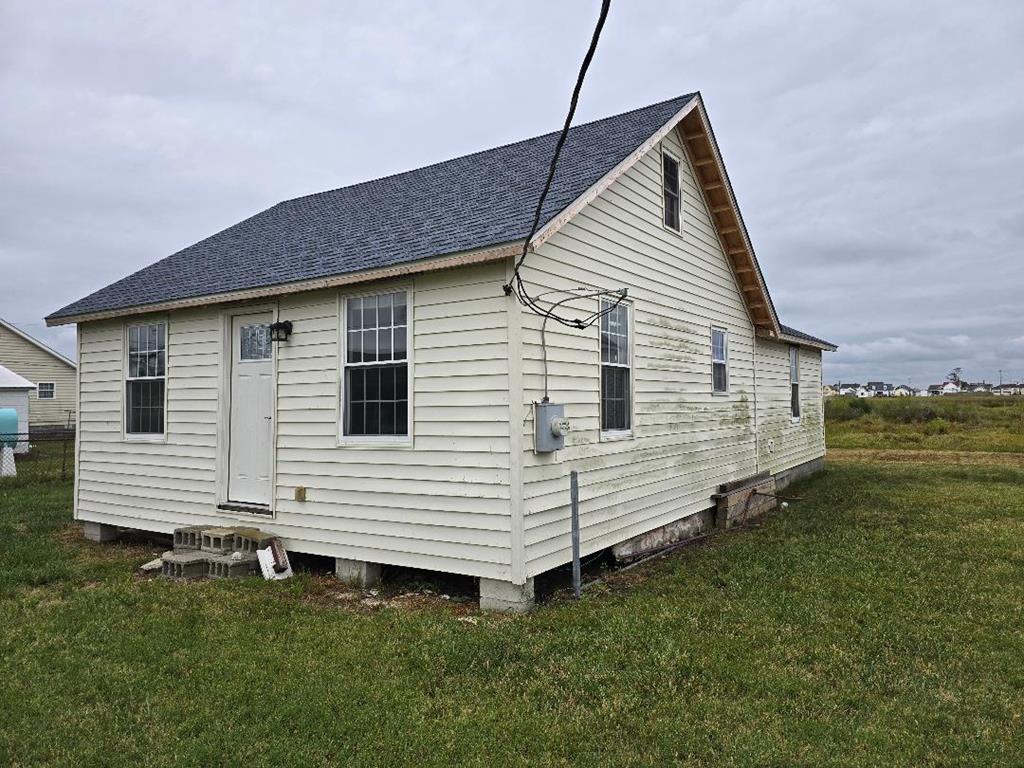 Bungalow in the suburbs of Tangier, actually said with tongue and cheek, for this area where tourists rarely go, it's set apart from the busy area of town, an all-residential area. This 2-bedroom, 1-bath, utility room, and sitting room, 775 sq' cottage property reaches the waterway called the Ditches.  Nearly all the renovations are in near completion. New roof, kitchen, bath, windows, and some flooring. Want to expand? The massive attic is perfect for doing so. Best for a year-round home. p.s. Bring the fishing gear, kayak, crab pot, etc.