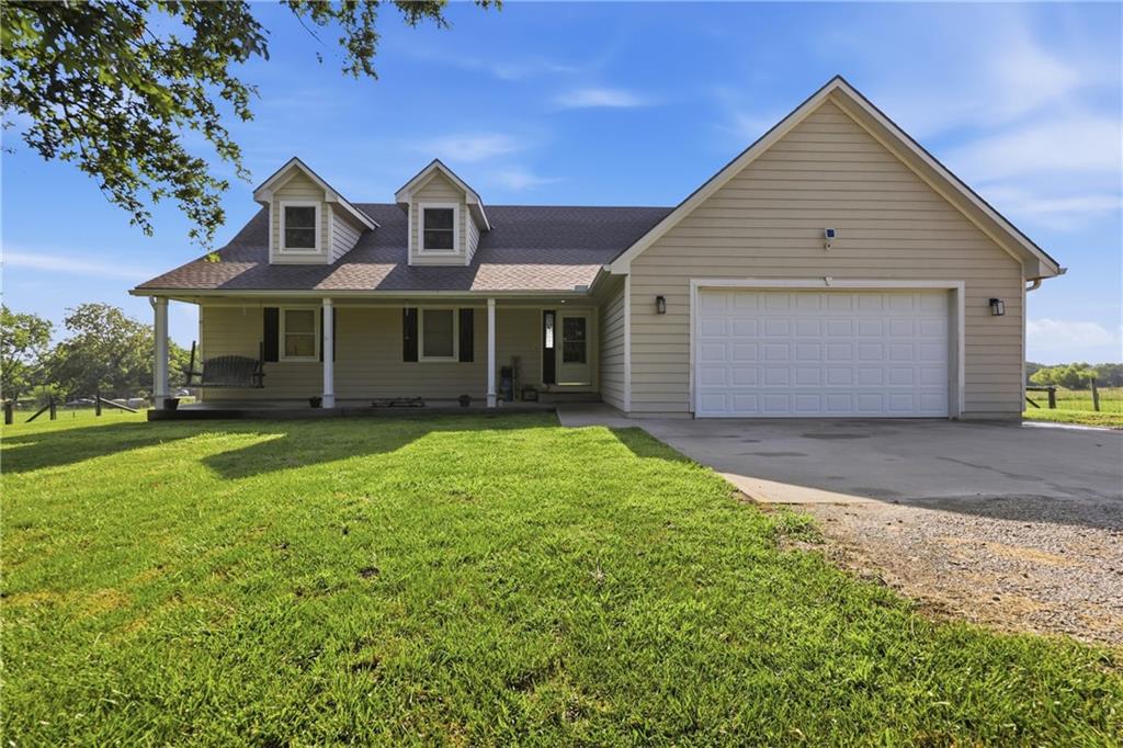 NOW OFFERING A $5,000 CARPET ALLOWANCE. Recent price reduction.  Motivated sellers.  You do not want to miss seeing this property.  It will check a lot of boxes.  Located off I49 between Adrian and Archie the house has plenty of room, a walk out basement, great loft area  If you have been thinking of a move to the country you will not want to miss this one.Welcome to country living at its finest with easy access to I49!  The first thing you will notice about this house is the porch swing that looks out over the trees in the front yard.The first floor includes three bedrooms and two baths.  The living area has a rustic wood accent wall that accentuates the vaulted ceiling.  The fireplace makes a cozy area to enjoy chilly evenings.  Eat in the kitchen with a deck that leads to the back pasture.  Main floor laundry will save you steps up and down the stairs.Upstairs is an office area and a bedroom.  Perfect for anyone wanting some seclusion in the house. The walkout basement has another bedroom, a full bath, and a living area.  Bonus room that can be used for a game room or storage.Love the 9.7 acres with a pond and access to another ½ pond.  Barn and fencing.  The seller is keeping the free-standing panels. This is a must-see property!  You will love country living!