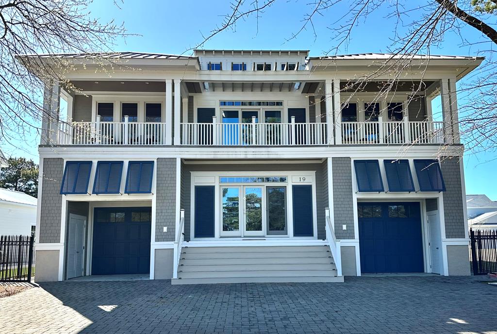 "WAVE ON WAVE" COASTAL CONTEMPORARY HOME IN BAY CREEK- GRAND BAHAMA model Marina Village East w/ beach & pool access. Fully furnished w/ a decorator's touch this popular vacation rental w/over 3500 Sq. Ft. has open concept living. Each of the 4 Bedrooms has its own en-suite bath. Huge gathering space upstairs central to each bedroom. Spacious family room w/ fireplace wraps into kitchen & dining area. Large kitchen, 2 large granite islands, wine coolers, mood lighting throughout. Wonderful space for entertaining family & friends. Dual upper & lower decks on front and back, plus screened eating porch. Split garages offer plenty of space for car, golf cart, beach gear & game room. New HVAC in 2025. In Historic Cape Charles, take golf cart to beaches, shops, restaurants, marinas & golf.