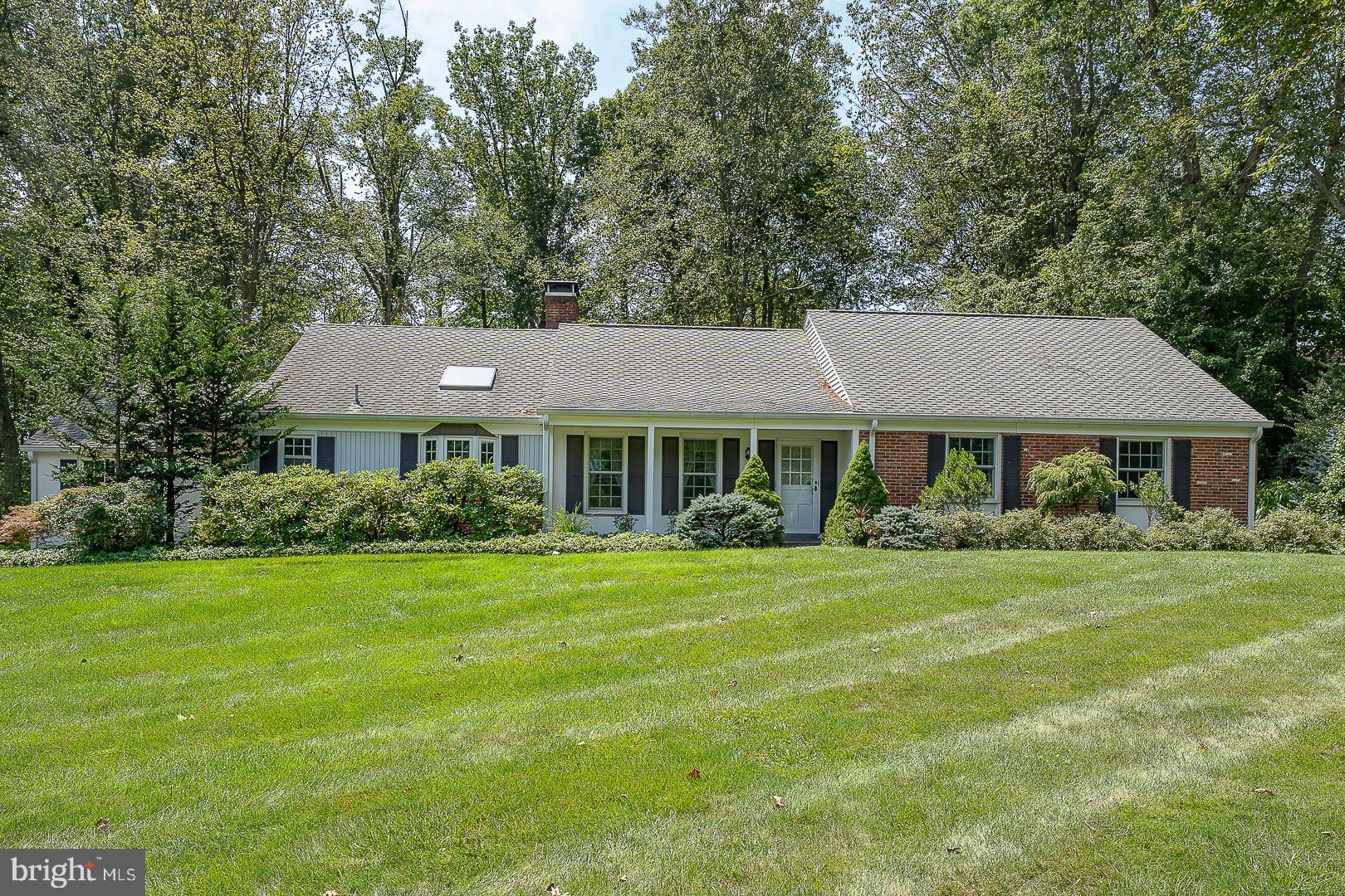 Welcome to 738 Woodcrest Road! This 3 Bedroom, 2 Bathroom Colonial Ranch is nestled on one of Wayne's most picturesque streets in the award winning Radnor Township School District. This home offers a rare opportunity to renovate or expand surrounded by many higher priced  properties. It features a spacious Living Room with hardwood floors, wood burning fireplace with a large picture window overlooking the lovely backyard. The Dining Room has hardwood floors, a chair rail and crown molding. The eat-in Kitchen features a sky light with plenty of room for cooking and entertaining.  A pocket door opens into the Family Room with a fireplace, hardwood floors, and a built-in desk and shelving. Step down from the Family Room into a sun filled Solarium with windows galore and separate heater and A/C for all year enjoyment. Back in the front Foyer which leads to the Primary Bedroom with hardwood floors and an ensuite updated Primary Bathroom. Next to the Primary Bedroom are two additional Bedrooms both with hardwood floors and a Hall Bathroom with a tub/shower. Stairs to the second floor lead to a floored Attic which is plumbed for a potential bathroom as well as an opportunity to add a fourth Bedroom. The basement is unfinished offering ample storage and potential for finished living space. The backyard has lush landscaping with a Shed housing an indoor hot tub. This home is being SOLD "AS IS".   It is ideally located just minutes from the train, major highways and the charming shops and restaurants  in the town of Wayne. With its wonderful setting, timeless appeal and endless potential, this home is ready for its next chapter. Welcome Home!