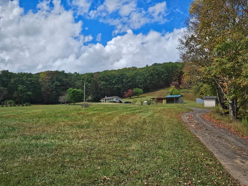 MOTIVATED SELLERS,  MAKE  A REASONABLE OFFER!! If you are looking for a beautiful mountain getaway to call home, vacation property, hunting property or whatever the reason, here it is!  The cozy cottage has been updated with new appliances, new Jotul cast iron gas heater, and a whole house generator. This 69.61 acres joins the Jefferson National Forest on 2 sides with multiple walking trails, 4 wheeling, large picnic areas and recreational opportunities. With approximately 25 +- cleared acres, start your mini farm with plenty of room for animals, gardening and fruit trees. For income potential, log the plentiful hardwoods or offer firewood to your neighbors and community.  Located minutes from I77 between Wytheville and Bluefield, and a short hike to the Appalachian Trail! For the motorcyclists, enjoy a beautiful scenic ride through the mountains!  For the skier, you're within 40 miles of the Winterplace WV resort!  For fisherman, less than an hour to the Claytor Lake State Park.  The property offers a large open shed for storage of vehicles, toys, tractors, and a separate electric meter for any type of hobby, wood work or crafting.  There are also 2 additional buildings that could easily be finished as guest quarters, one Amish built 12x40 with covered front and back areas, the other 16x24!  Another building with covered sheds on 2 sides that could be converted to a tack room with horse stalls. There's plenty of hay/pasture for animals if you desire! Down by the creek there's a wood shed that's stocked with wood for the firepit!  Let your imagination run wild, create a hobby farm or an Airbnb for avid outdoor lovers!  For nature/bird lovers and just the peace and serenity of country living, take the path down by the creek, lined with beautiful mountain laurels, sit by the firepit, listen to the sounds of the night, or sit on the front porch of the comfy little home and watch the seasons change!  Make an appointment soon to see, this property won't disappoint!