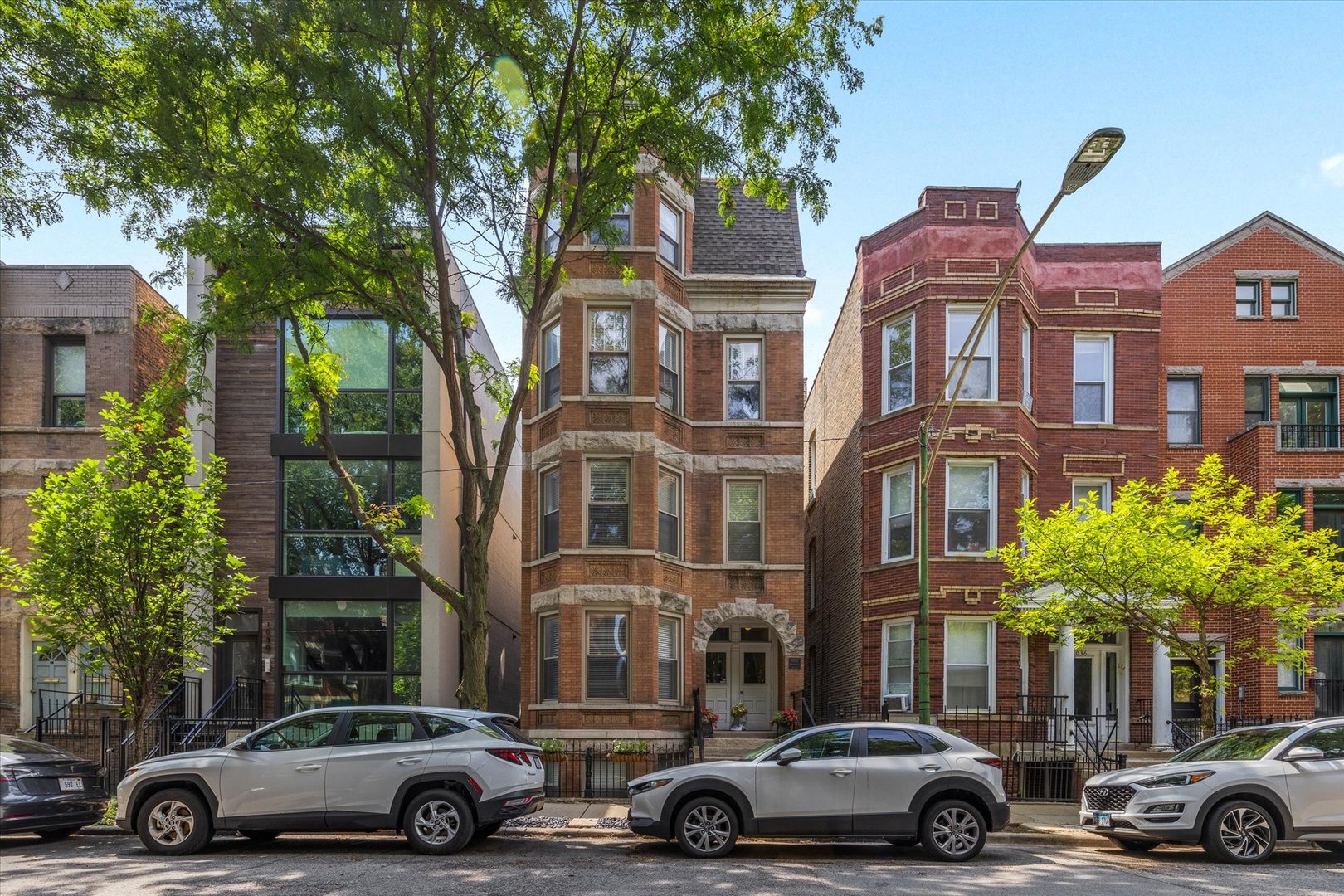 Stunning 2-bedroom, 2-bathroom condo in a prime location Wicker Park! This move-in-ready condo is situated on a quiet, tree-lined street, vintage brick building just steps from vibrant Division street local attractions, shopping, dining, and easy transportation access to downtown Chicago and the Blue Line easy commute to O'hare. The modern open floor plan features a beautifully upgraded kitchen with stainless steel appliances, granite countertops, and a large peninsula perfect for entertaining. Hardwood floors run throughout the spacious living area, which is filled with natural light. The primary suite boasts with ample space and a wall to wall closet that feels like a luxurious suite. Bathroom has a large walk in shower. Office area perfect for work from home, work out area, lounge area or second tv area outside the primary bedroom. In-unit washer/dryer with ample storage. Step outside to your private balcony for morning coffee or evening relaxation and a common space back yard. Dogs are allowed. The cherry on the cake is the dedicated deeded parking spot completes this fantastic offering. Don't miss out on this rare opportunity! Sellers have updated the refrigerator 2021, dishwasher 2021, microwave 2017, garbage disposal 2020, hot water tank 2018, washer dryer combo 2022, ring doorbell 2020, balcony/deck re-sealed 2021, Roof replaced 2013 and 2020 an inspection, Turf backyard 2021. Furnace and air conditioner have had yearly maintenance.