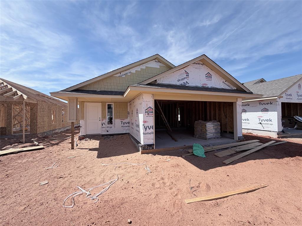 This beautiful new home has the perfect layout for both entertaining and daily living. You will love the stunning wood tile that flows throughout all of the main areas, tying the living, kitchen and dining together seamlessly. The kitchen features custom cabinets, a large centered island with deep sink, stainless steel Samsung appliances and much more. The home is flooded with natural light from the abundance of windows in the living room and dining area, giving a homey feel. The primary bedroom is very spacious and the en suite has a luxurious floor to ceiling roomy tiled shower that will make you feel pampered. Both spare bedrooms are situated near the guest full bath and linen closet for convenience. This home is very energy efficient and even has a handy EV charger in the finished garage. Come and check out this home while it is still available!