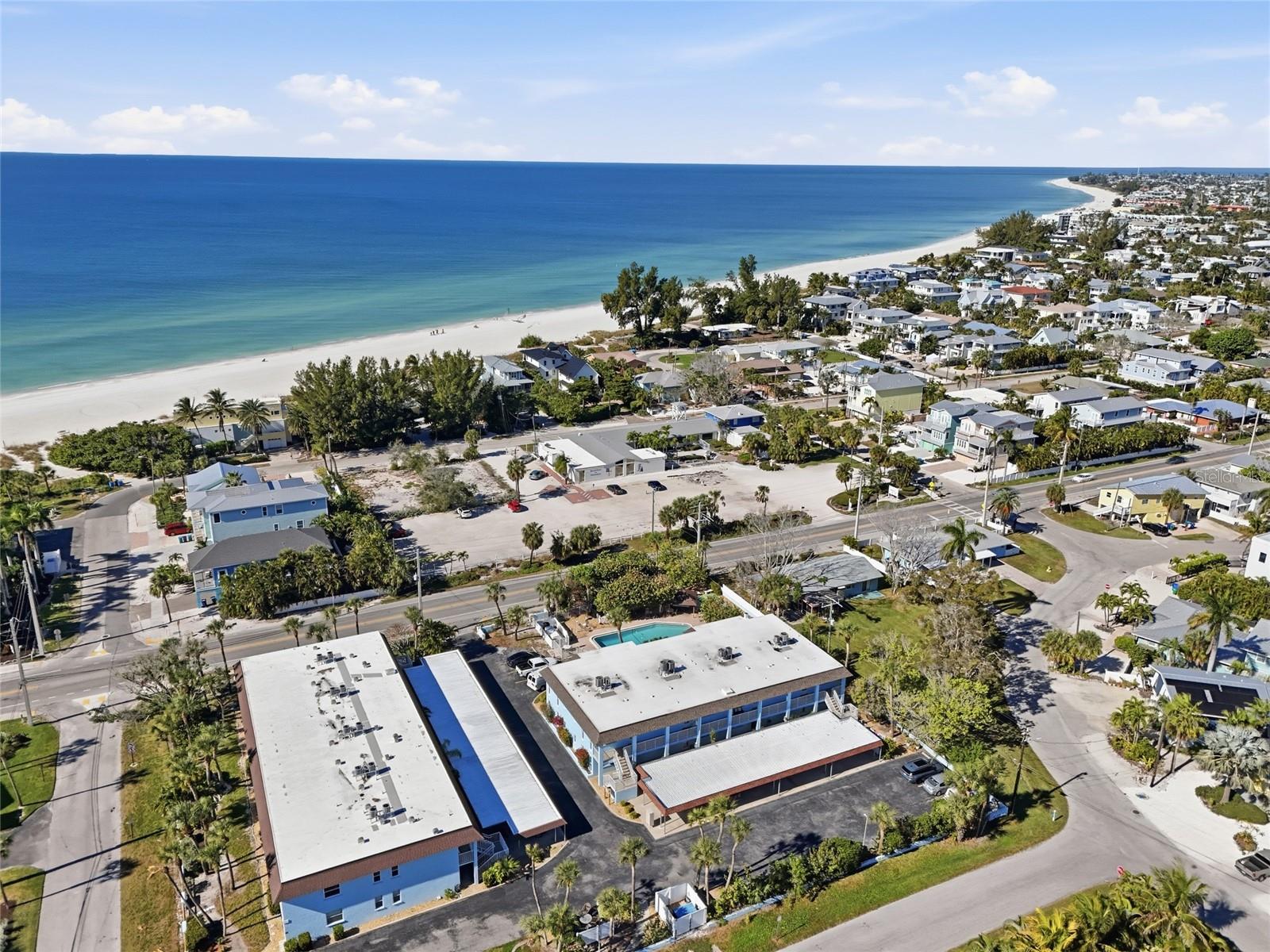 Under contract-accepting backup offers. Steps from the Gulf and newly approved WEEKLY rental policy!  Experience the best of Anna Maria Island in this charming, ground-level 2-bedroom, 2-bathroom condo located in a premier Holmes Beach community. This residence perfectly balances modern upgrades with the relaxed, "Old Florida" charm that makes this island world-famous.THE INTERIOR: The heart of this home is the newly remodeled kitchen, featuring crisp quartz countertops, contemporary cabinetry, high-end hardware, and a deep farm sink. Sold fully turnkey, the transition to your new beach life is seamless.OUTDOOR LIVING & PRIVACY: Relax and enjoy your morning coffee on your covered, screened-in lanai which overlooks the sparkling community pool or step out for effortless access to the heated swimming pool for a midday dip! For ultimate seclusion, the primary suite features a rare, private open-air patio. Complete with a private outdoor shower, it is a serene sanctuary perfect for sunbathing or getting lost in a good bookCOMMUNITY & LOCATION:  Located directly across the street from the sugary sands of the Gulf of Mexico, this complex offers a true resort feel with a heated pool, BBQ grilling area, and shuffleboard courts. Whether you’re looking for a permanent residence, a seasonal getaway, or an investment, the flexible rental policy - WEEKLY RENTALS ALLOWED - offers great potential.HIGHLITES:• Prime Location: Easy walk to shopping, dining, and island entertainment, with quick access off-island.• Pet-Friendly: Owners are welcome to bring their pets!• Maintenance-Free: Ground-level entry with no stairs to navigate.ADDITIONAL OFFERINGS: covered parking, LG storage closet, small enclosed area off of BD #2  for office space or additional storage.Don't miss this opportunity to own a piece of paradise where the beach is your backyard and every day feels like a vacation!