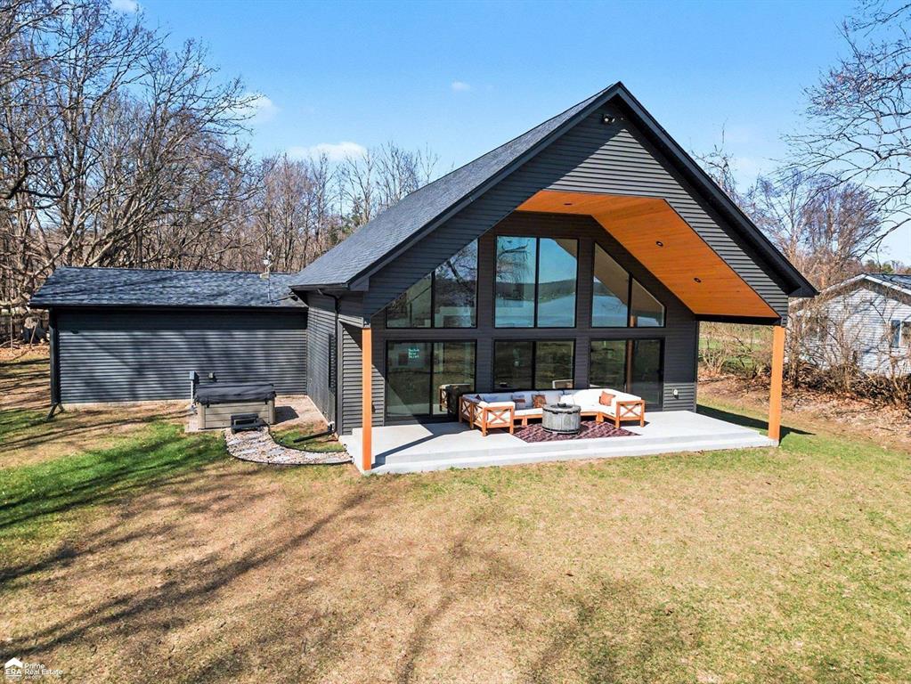 OPEN HOUSE: Saturday, April 18th from 1-3 PM. Stunning, modern luxury home on Holloway Reservoir! This 3-bedroom, 2-bath home was built in 2022 and offers 1,780 sq ft of luxury lakefront living. The open floor plan features soaring 20-ft ceilings and panoramic water views. Main-floor primary suite includes a gorgeous black porcelain shower and spa-like bath, plus convenient main-floor laundry. The kitchen boasts a porcelain backsplash, high-end finishes, and flows seamlessly into the great room - perfect for entertaining. Upstairs, a spacious loft provides a flexible third bedroom or office space with a hidden bookshelf closet. Enjoy 118 feet of private water frontage, a covered back patio - the showstopper of the home - plus a hot tub with peaceful views of the reservoir and surrounding wildlife. Situated on just over an acre, this newer-built retreat combines modern design, comfort, and the tranquility of lake living.