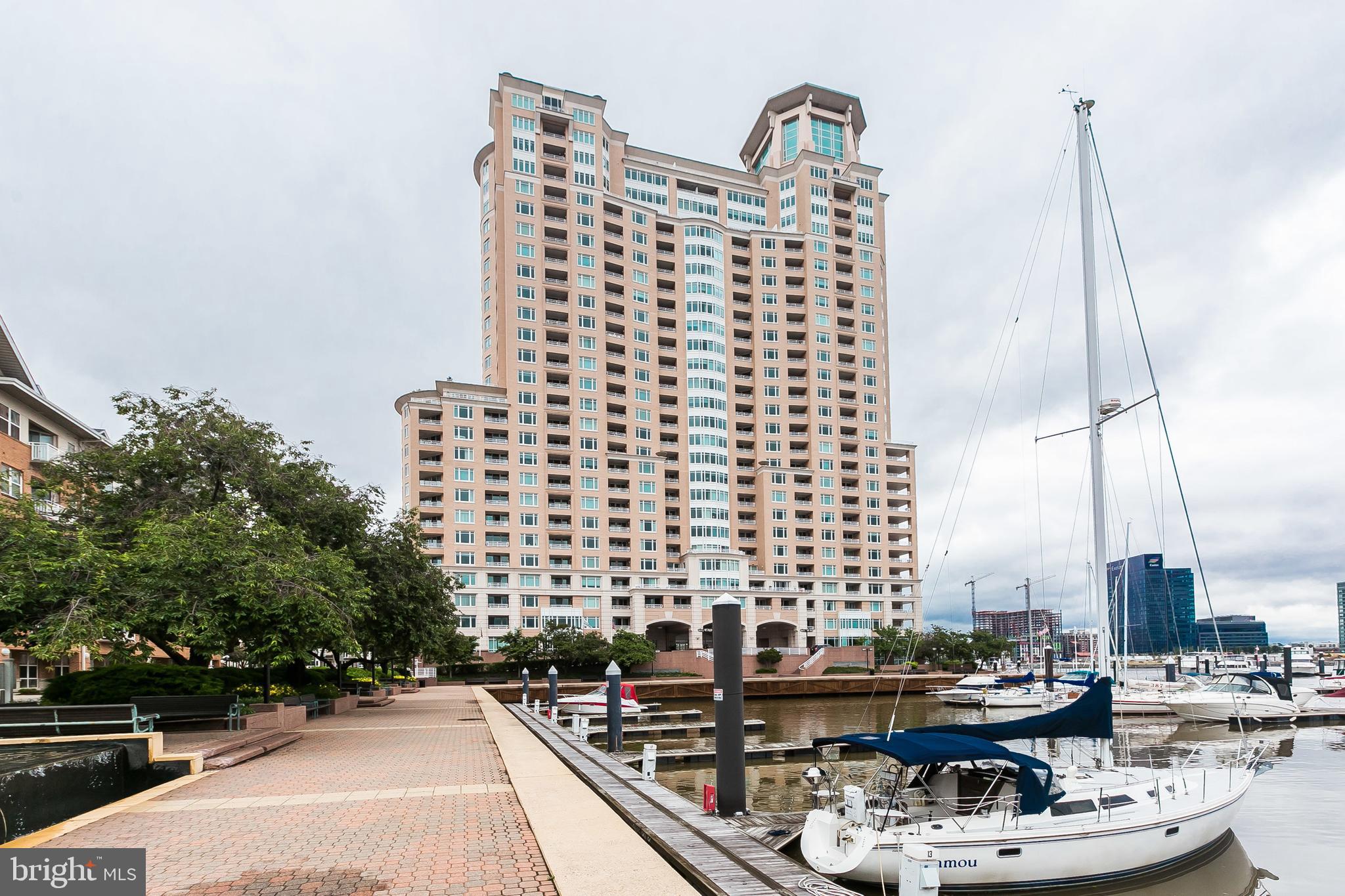 Excellent Inner Harbor city lights + sunset views over Federal Hill Everyday! Enjoy the sights from this 2BR/2 BA condo with corner balcony to enjoy indoor/outdoor entertaining year-round.  Fine features of marble, granite and wood for luxury living! Master Bedroom offers double door entry, bay windows, plenty of closet space, large bath with soaking whirlpool tub and standing shower. 2-Garage parking spaces included. Additional spaces available for rent. Plenty of guest parking. Comfortable living with array of building amenities-24/7 front desk concierge, guest valet, fitness center, steam/sauna, indoor/outdoor pools, business center, bike storage, social lounge and dining room plus billiards! Beautifully landscaped grounds with seasonal flowers, water features, on-site restaurants, banking and security staff. Excellent location near downtown business district, stadiums, gourmet restaurants, Harris Teeter, shopping, MARC train and only 9 miles to BWI Airport!